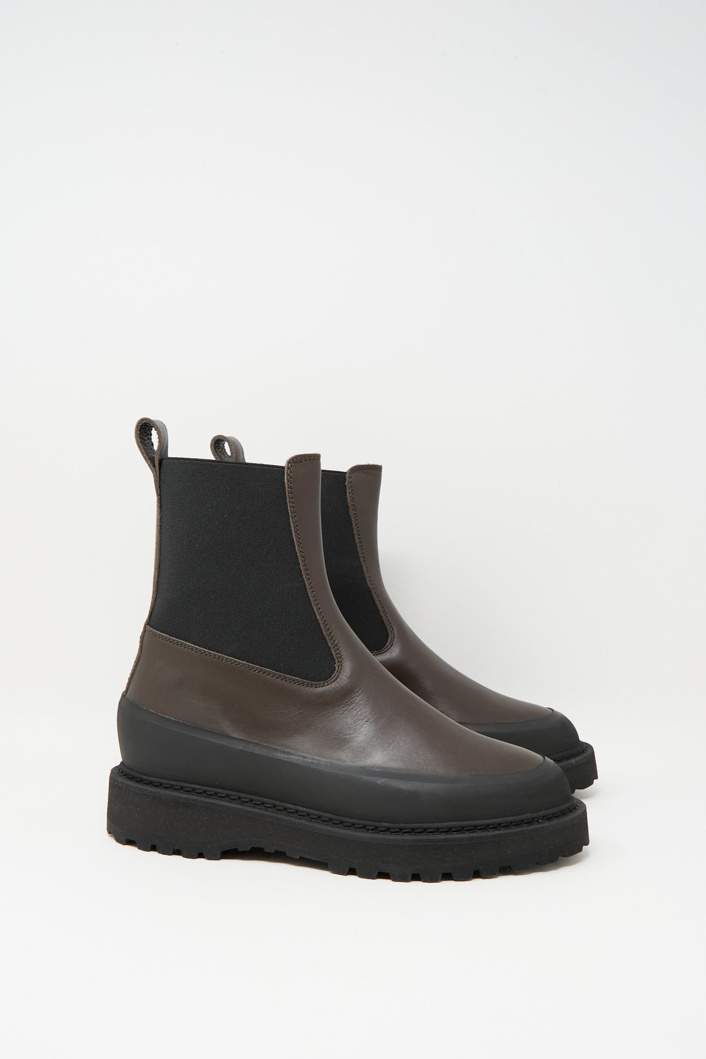 The Chelsea Dolomite in Chocolate by Le Monde Beryl features chocolate leather, black elastic side panels, thick black rubber soles, and a stylish pull-tab, all displayed against a plain white background.