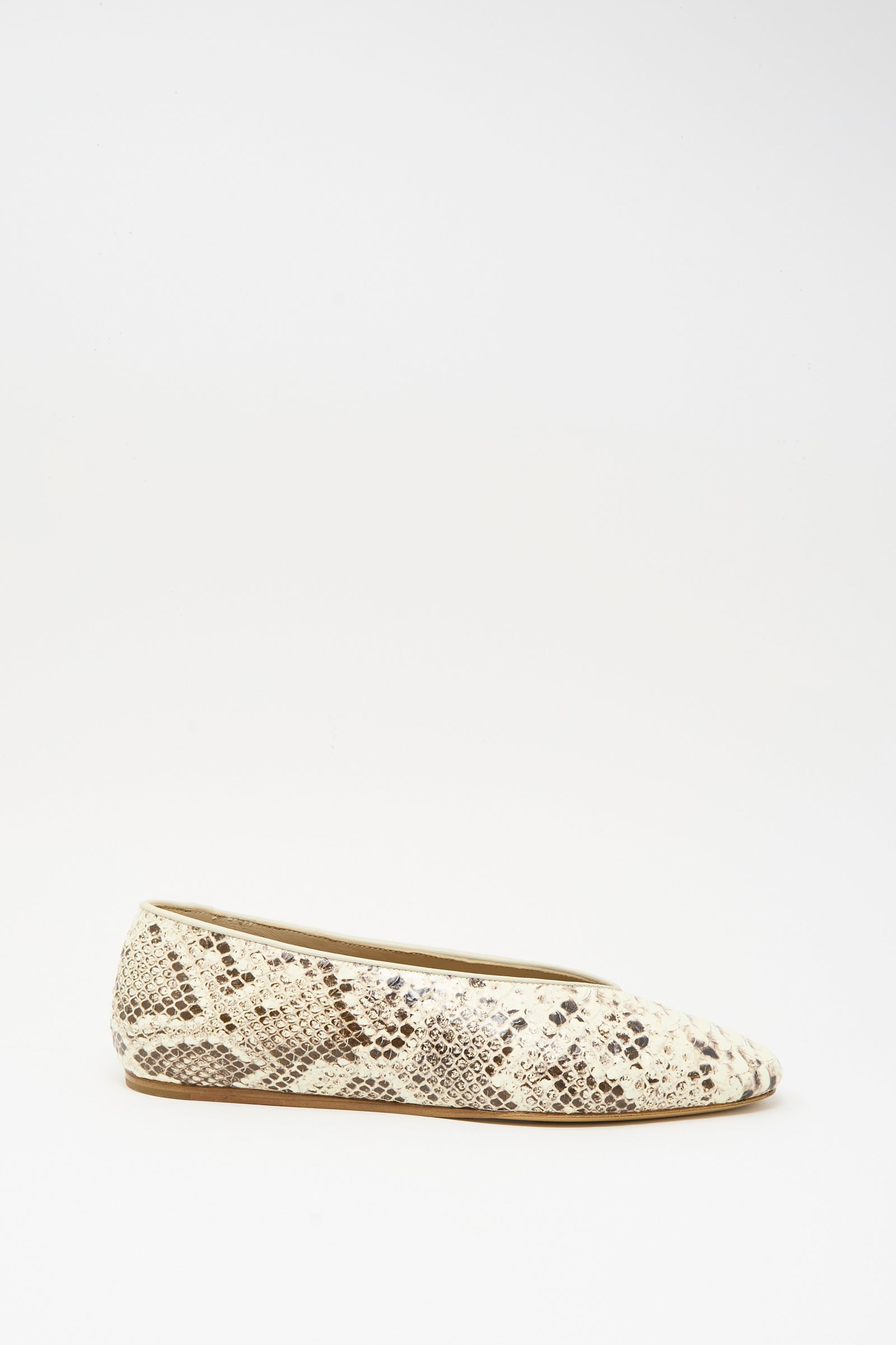 The Classic Regency Flat in Roccia by Le Monde Beryl is crafted from snake embossed leather, showcasing a beige and brown snakeskin pattern, displayed in side profile against a white background.