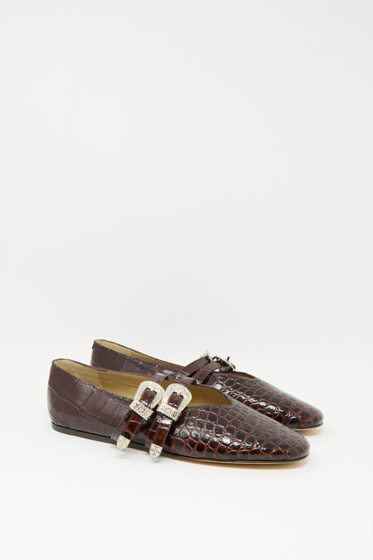 The Claudia Slipper in Coco Brown by Le Monde Beryl features a crocodile-pattern calf leather design with silver buckle details, shown on a plain white background.