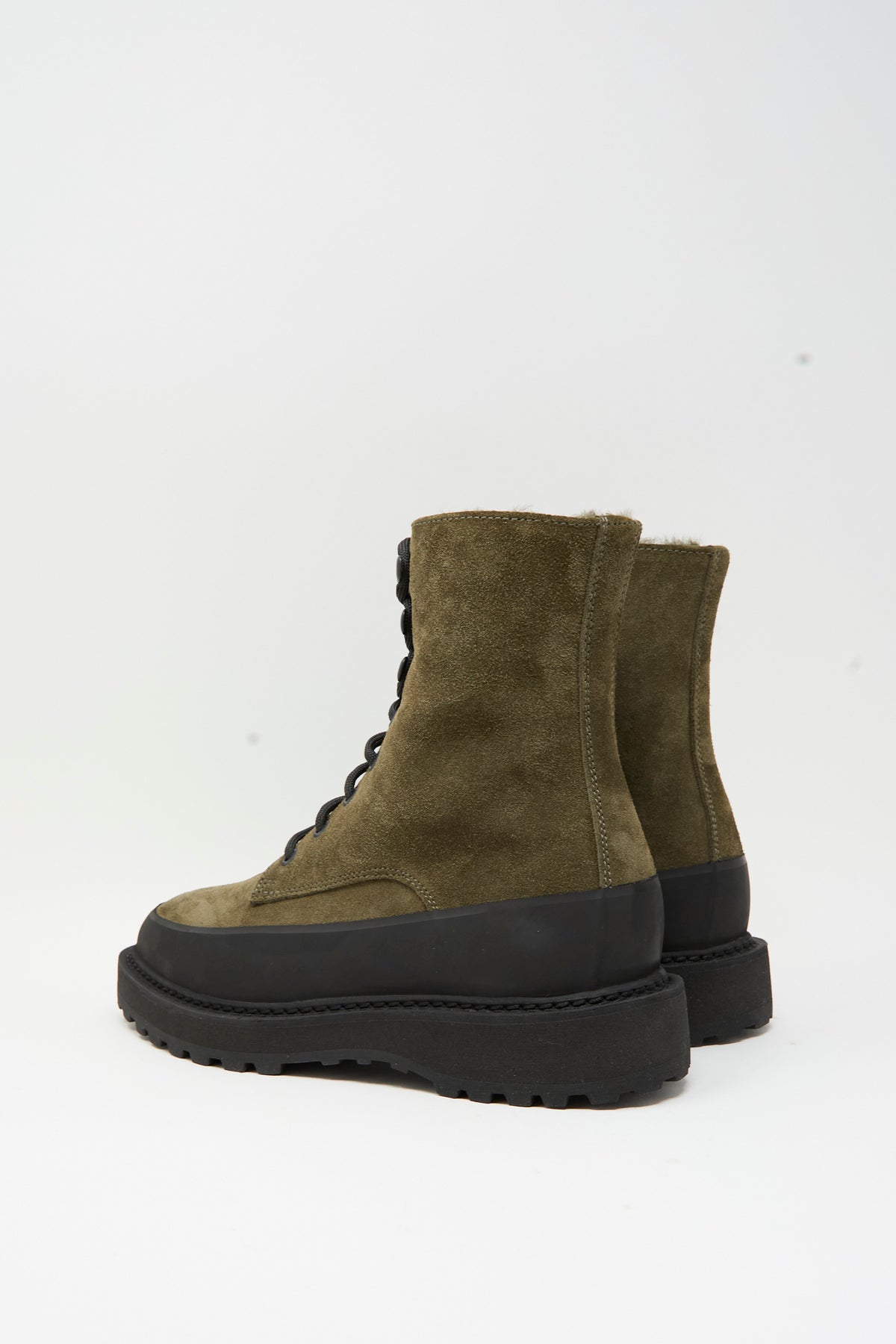 Le Monde Beryl Dolomite Boot in Military: olive green suede lace-up boots with a shearling lining, a thick black rubber mudguard, and a chunky lugged sole.