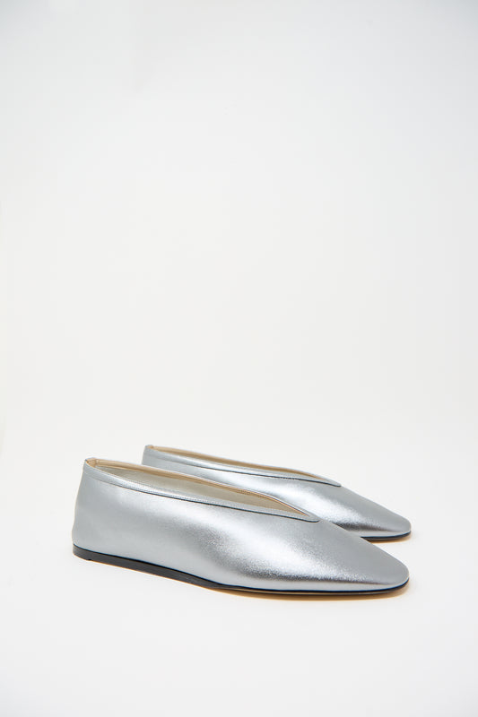 A pair of Le Monde Beryl Leather Luna Slippers in Silver with a simple, sleek design and cushioned insole, against a plain white background.