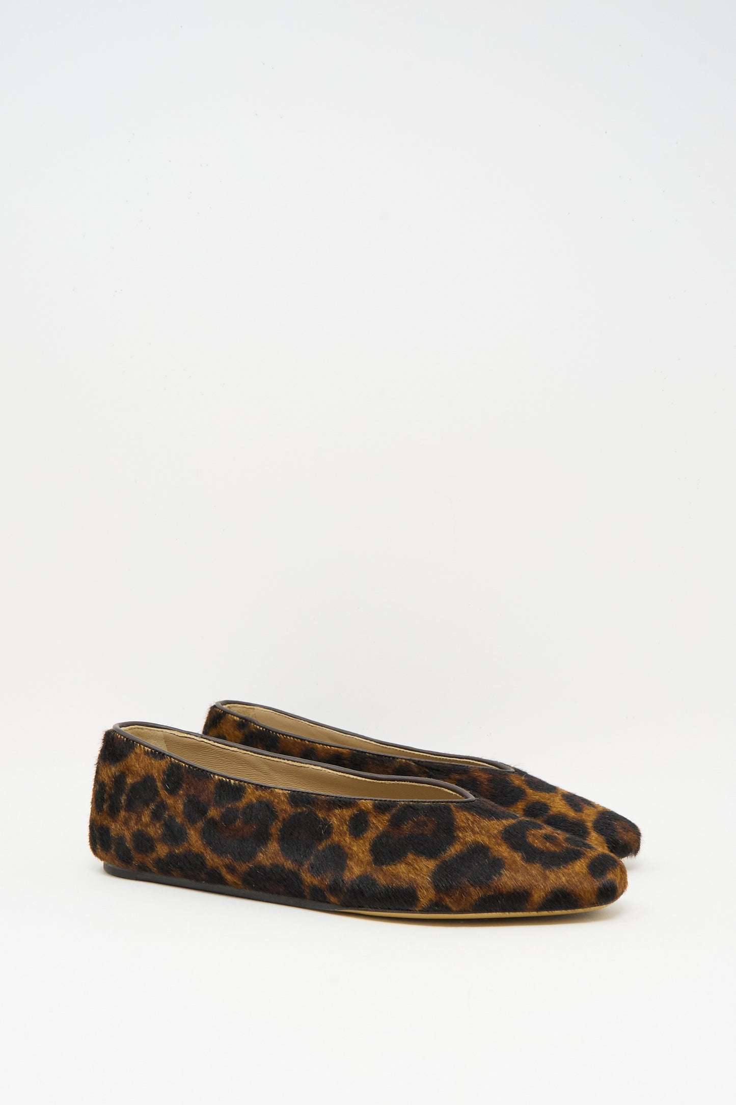 The Regency Slipper in Leopard by Le Monde Beryl features calf hair with a leopard pattern, rounded toe, and Italian craftsmanship, shown on a plain white background.