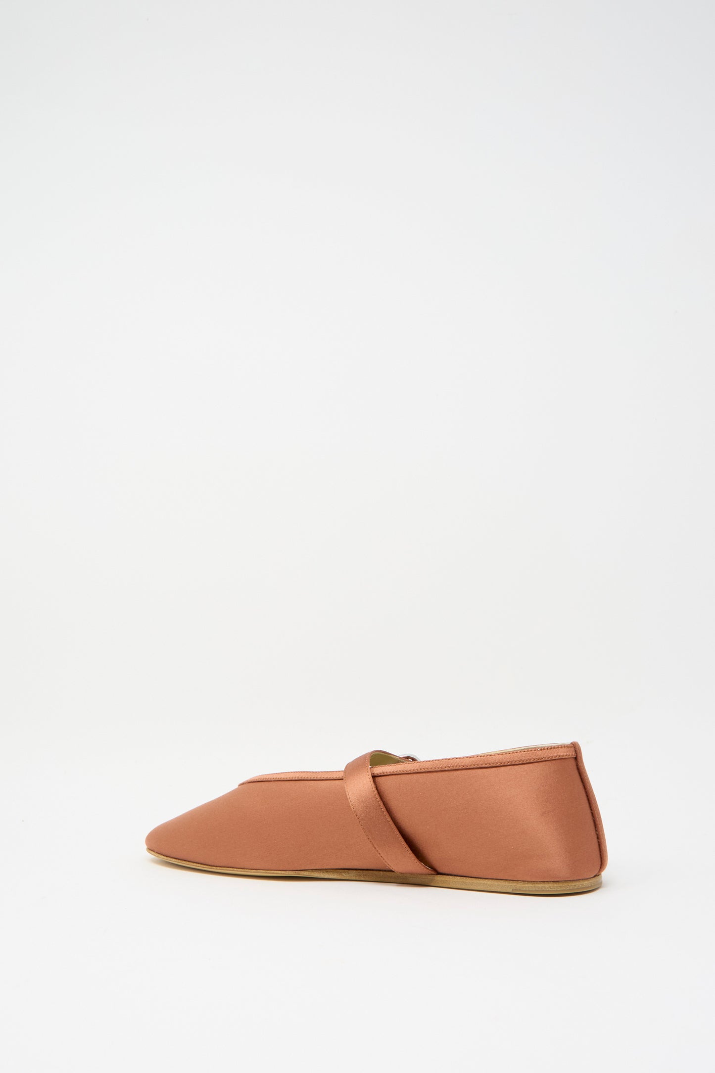 Rust-colored Stretch Satin Stella Slipper by Le Monde Beryl, featuring a strap across the top, shown in side view against a plain white background.