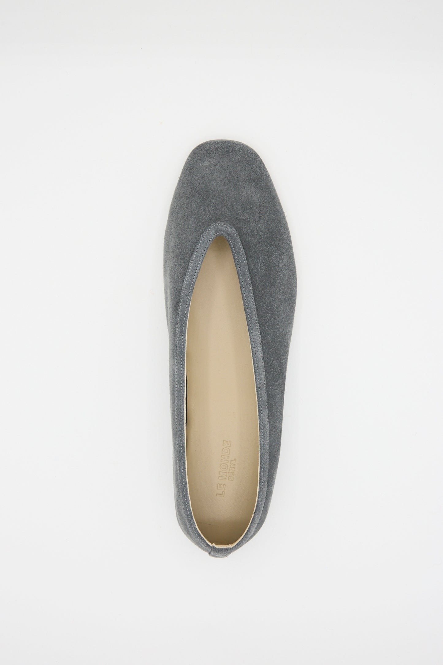 The Suede Luna Slipper in Anthracite by Le Monde Beryl is displayed from above on a plain white background, featuring a gray suede design with a calf leather insole and slightly pointed toe.