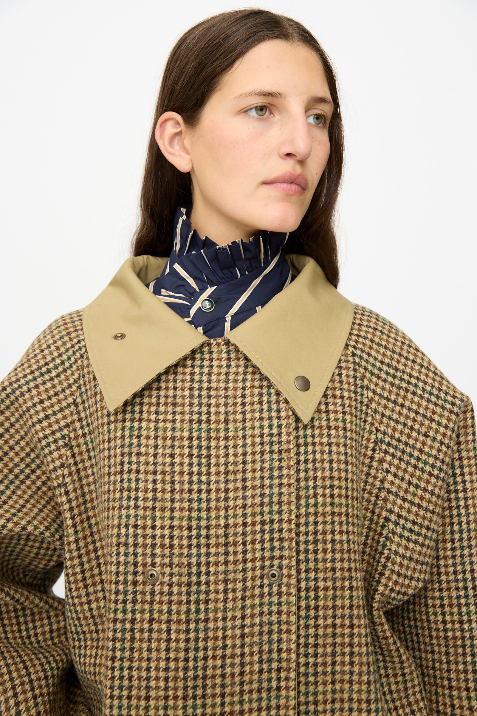 A person wearing the Dickens Moon Reversible British Trench in Taupe by Les Prairies De Paris, standing against a plain white background.