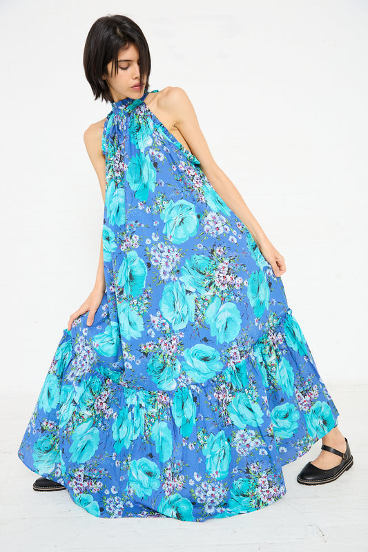 A person wearing the Loretta Caponi Melinda Dress in Sky of Roses poses against a plain white background.