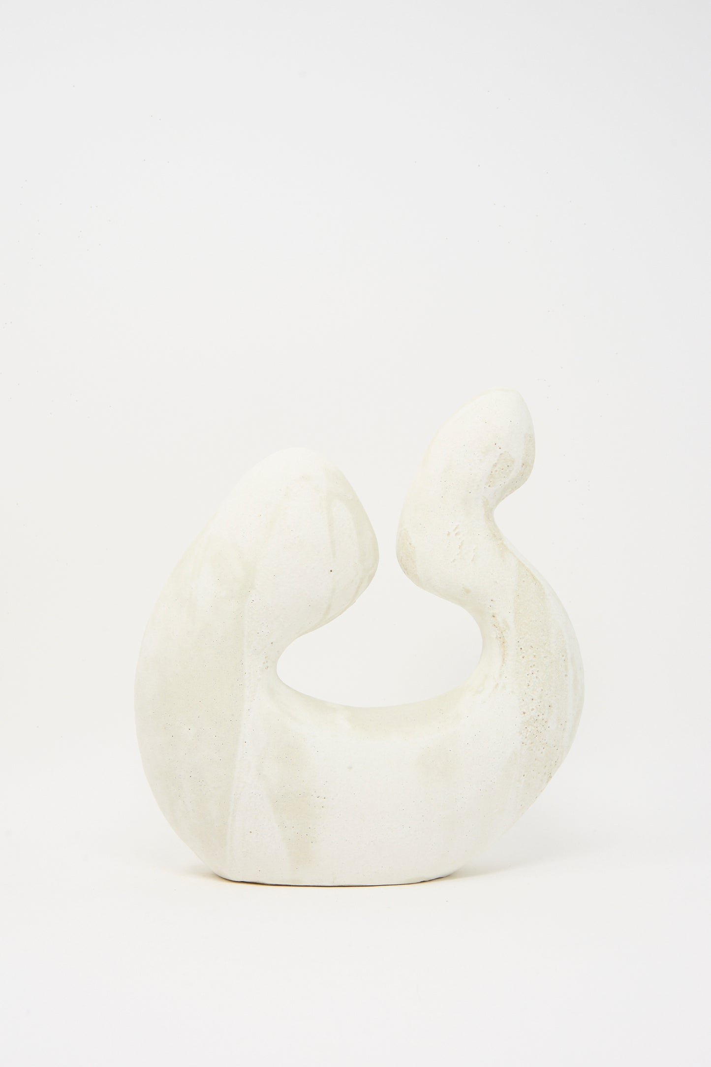 Hand Built Vessel No. 000980 by Lost Quarry: a white ceramic sculpture featuring smooth, curved forms crafted from sculpture clay, displayed against a plain white background.