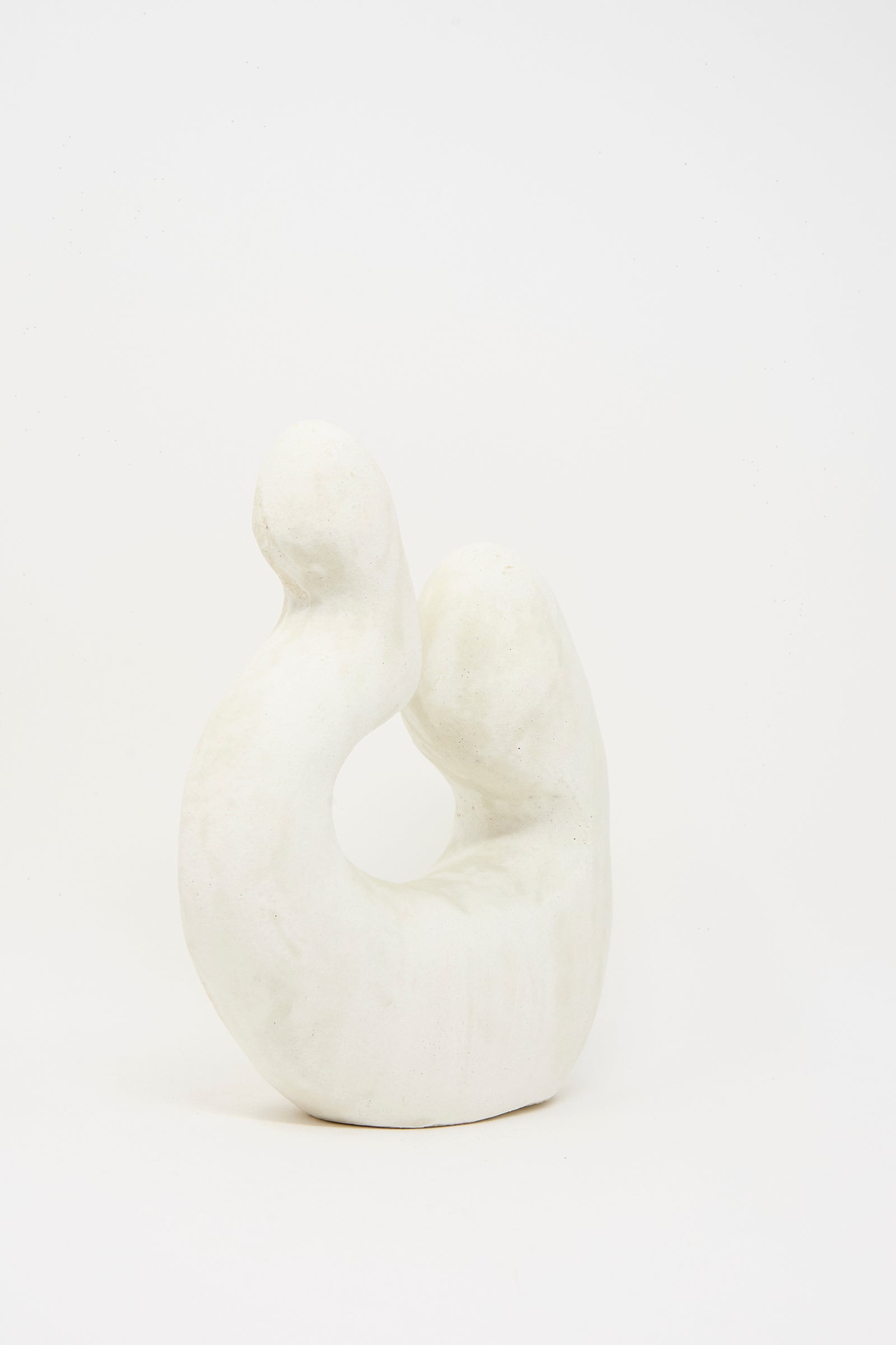 Hand Built Vessel No. 000980 by Lost Quarry is a white ceramic sculpture featuring smooth, curved organic forms and a subtly textured finish, displayed against a plain white background.