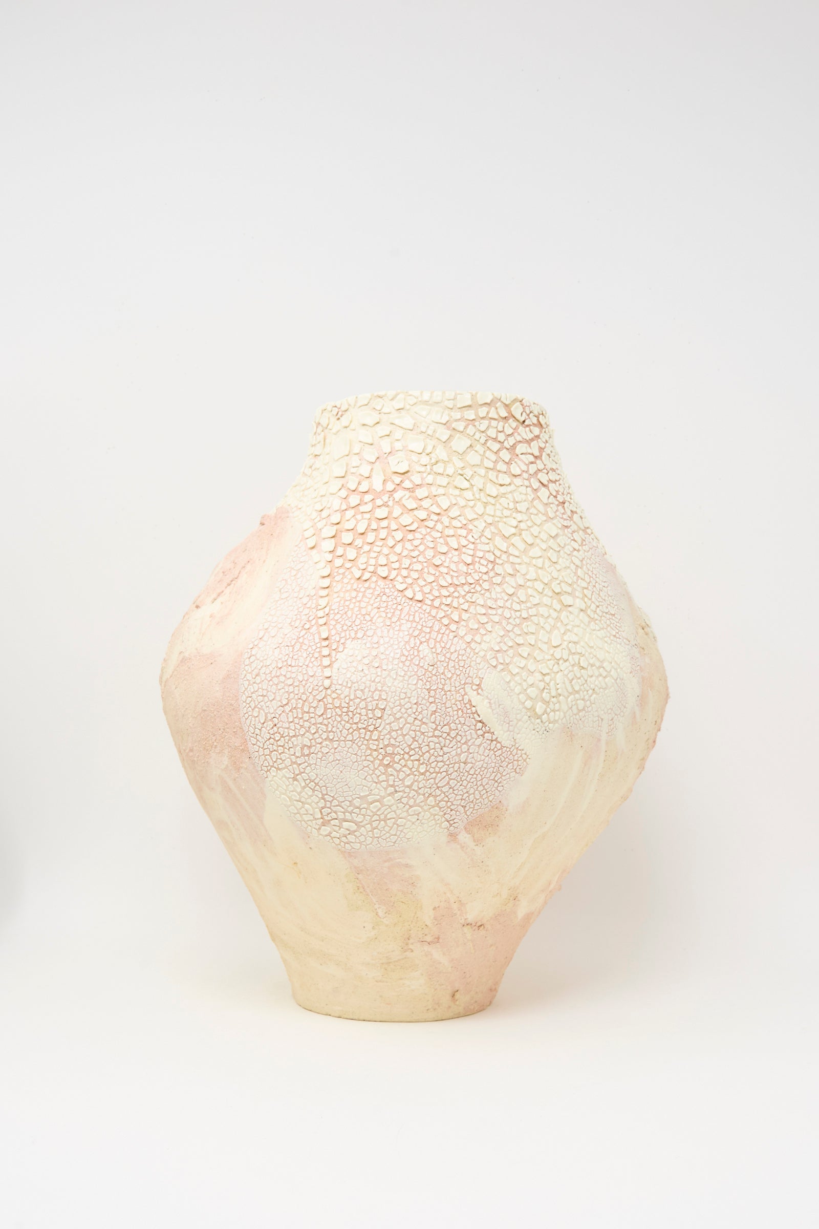The Hand Built Textured Vessel in Pale Pink by Lost Quarry features a wide body, narrow neck, pale pink and cream colors, and a crackled surface for texture.