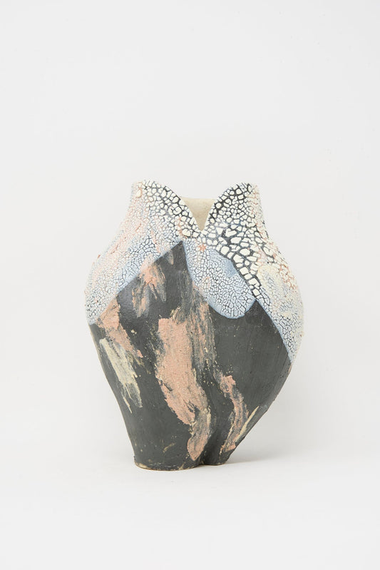 The Lost Quarry Medium Hand Built Textured Vessel in Black Pink Multi features a marbled black, white, and pink finish with a textured surface and cracked detail near the rim.