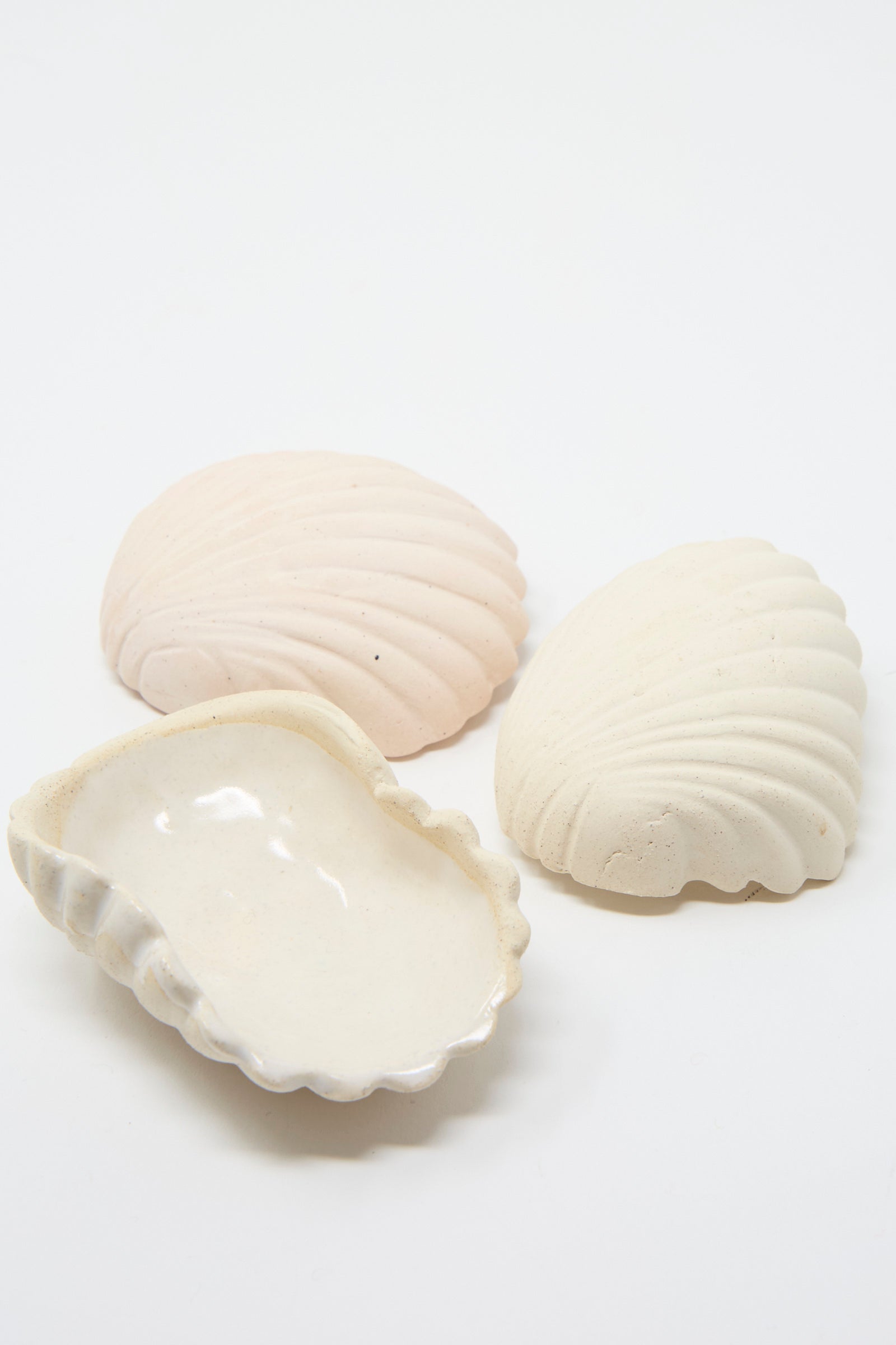 Three Small Ceramic Shell Dish in Cream by Lost Quarry lay against a plain background.