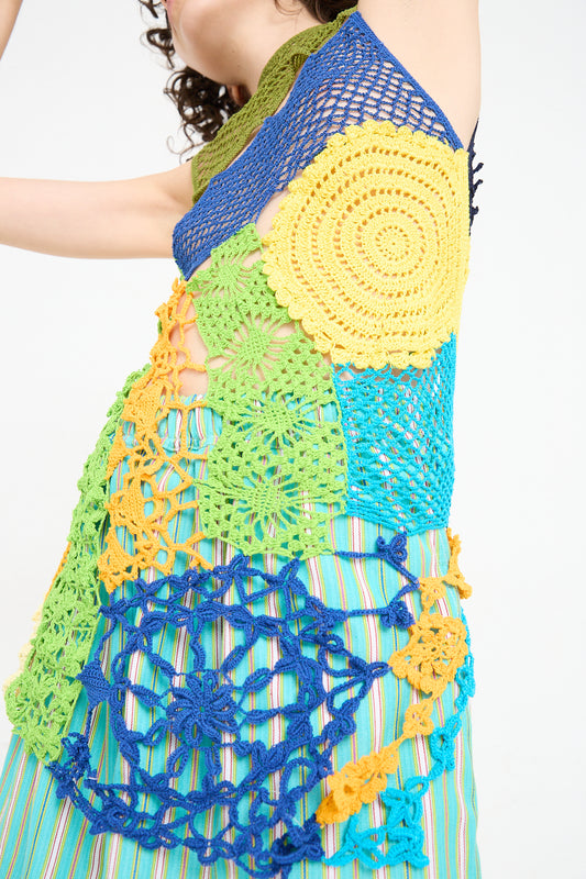 A woman wearing a Luna Del Pinal Labor De Retazos Crochet Mini Dress in Multi Noise.
