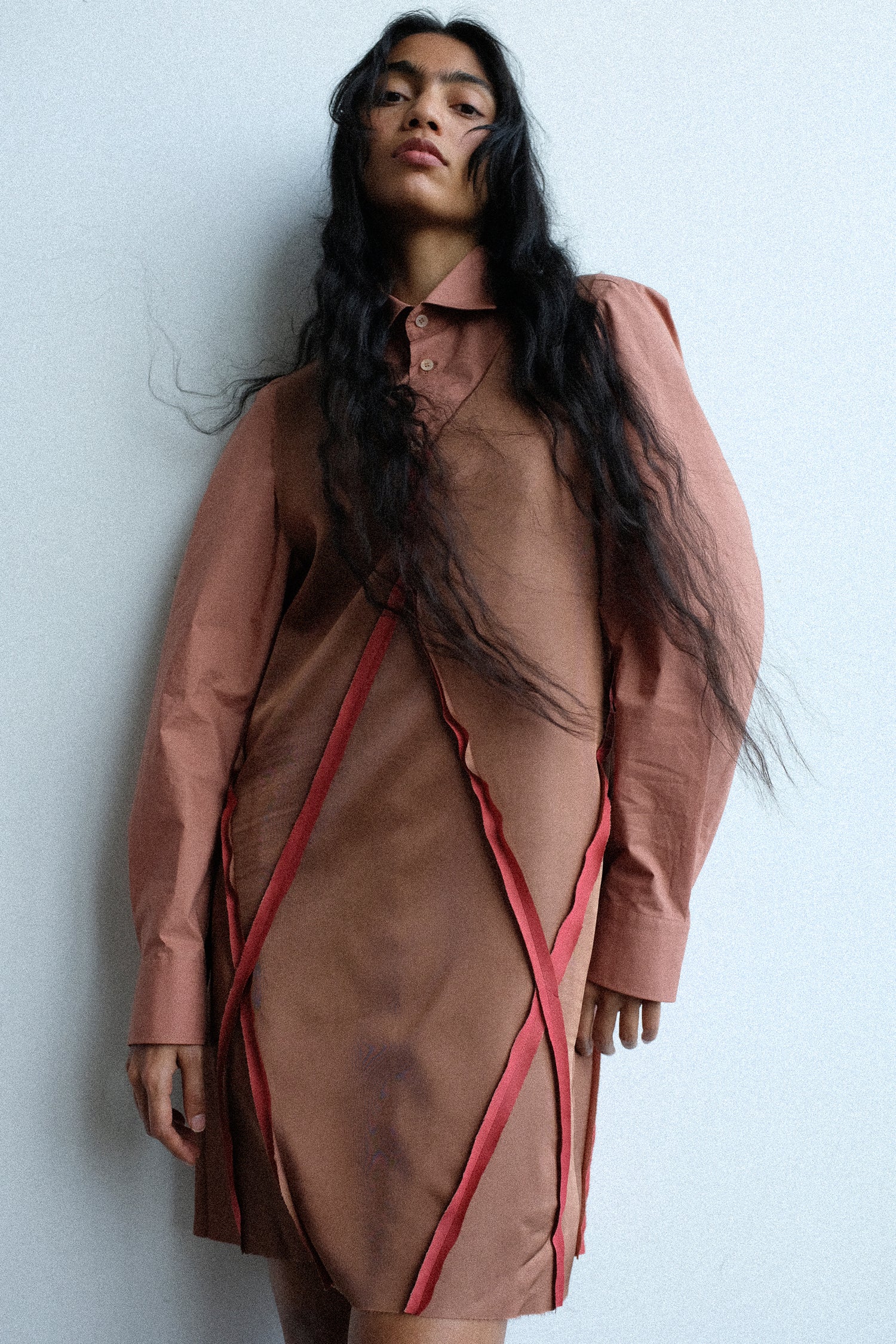 Woman wearing MM6's Midi Dress in Light Brown against a white background