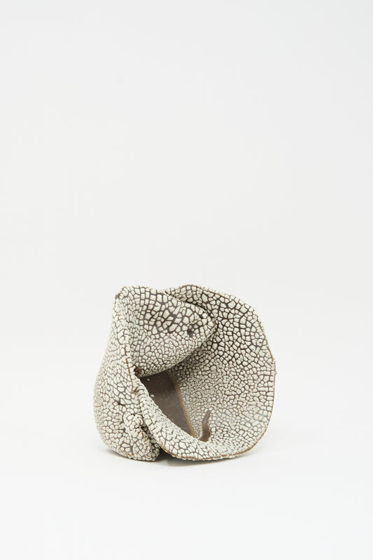 The MONDAYS Folded Bowl in Crawl I features a textured, irregular shape with a cracked white glaze pattern, displayed on a plain white background.