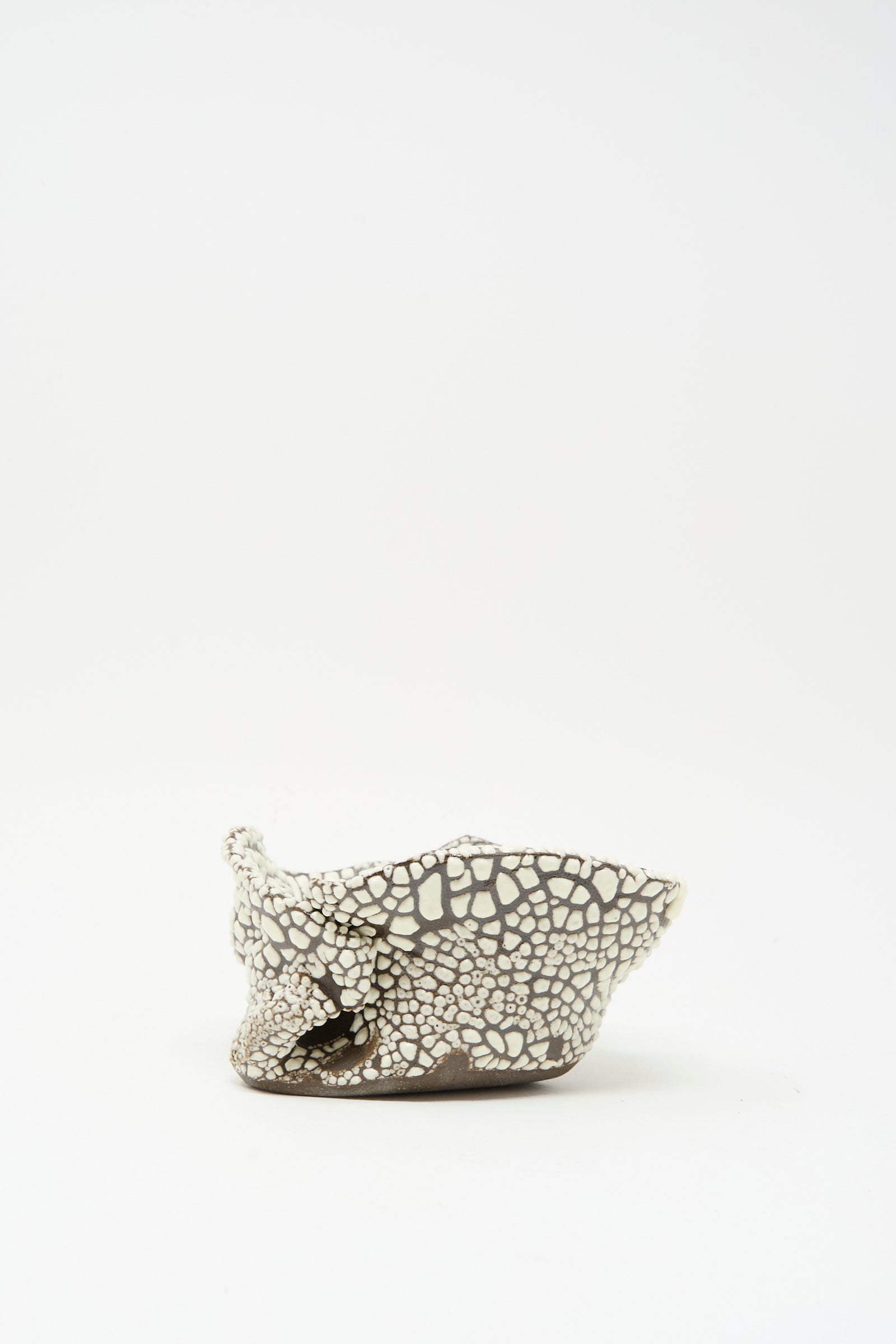 The MONDAYS Folded Wavy Bowl in Crawl IV, a hand-built piece with a crackled brown and crawling white glaze, features an irregular form and sits on a plain white background.