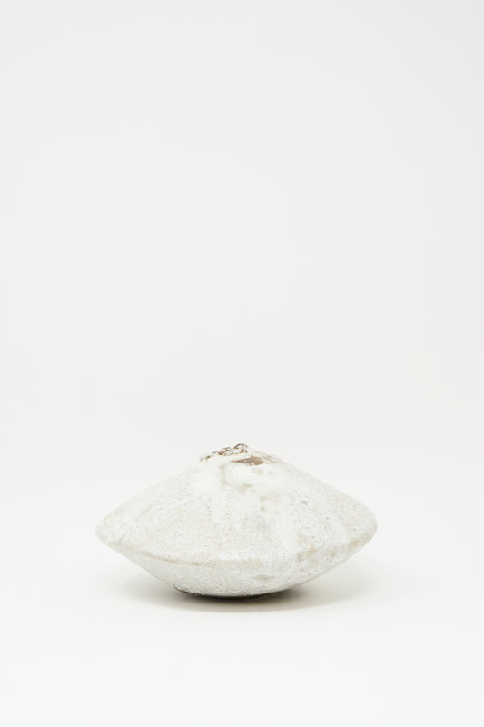 The MONDAYS Ikebana Vase in White over Dark Brown is a round, flat hand-built vase with a central opening, finished in smooth white glaze and displayed against a plain white background.