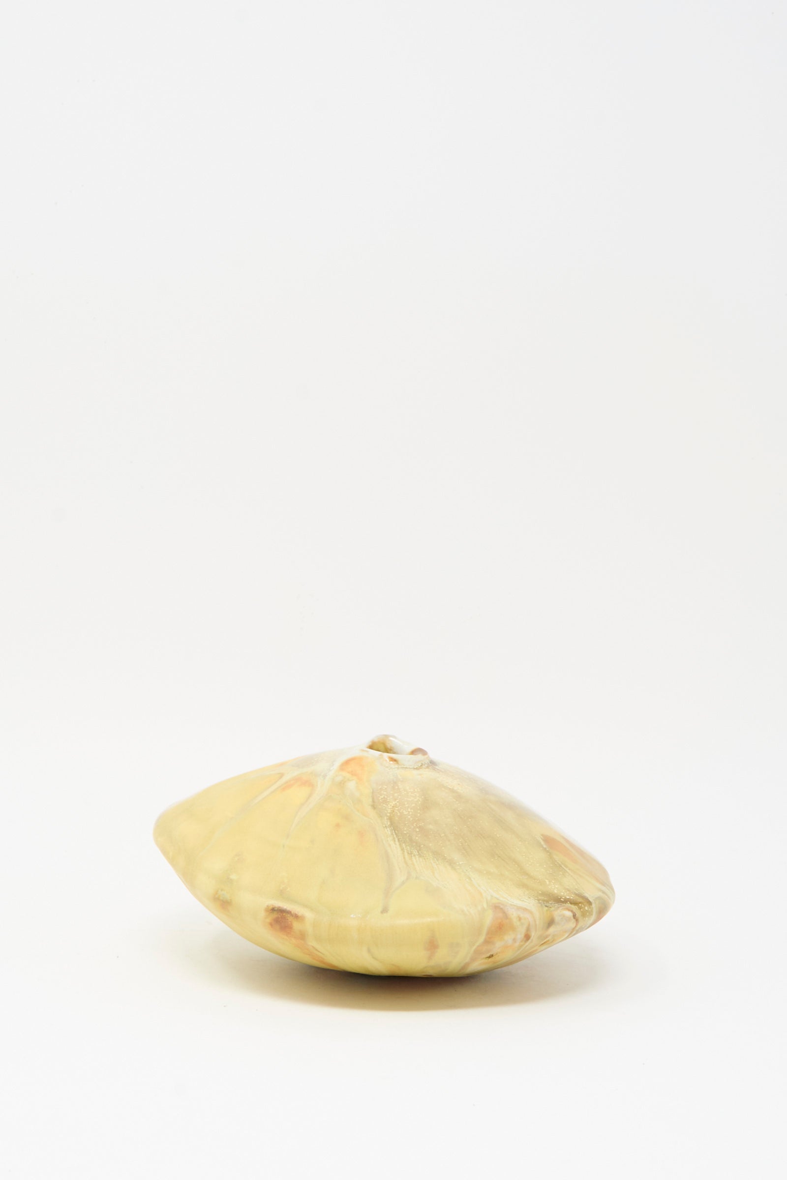 The MONDAYS Soda-Fired Ikebana Vase No. 1, featuring pale yellow and beige hues, is displayed on a plain white background.