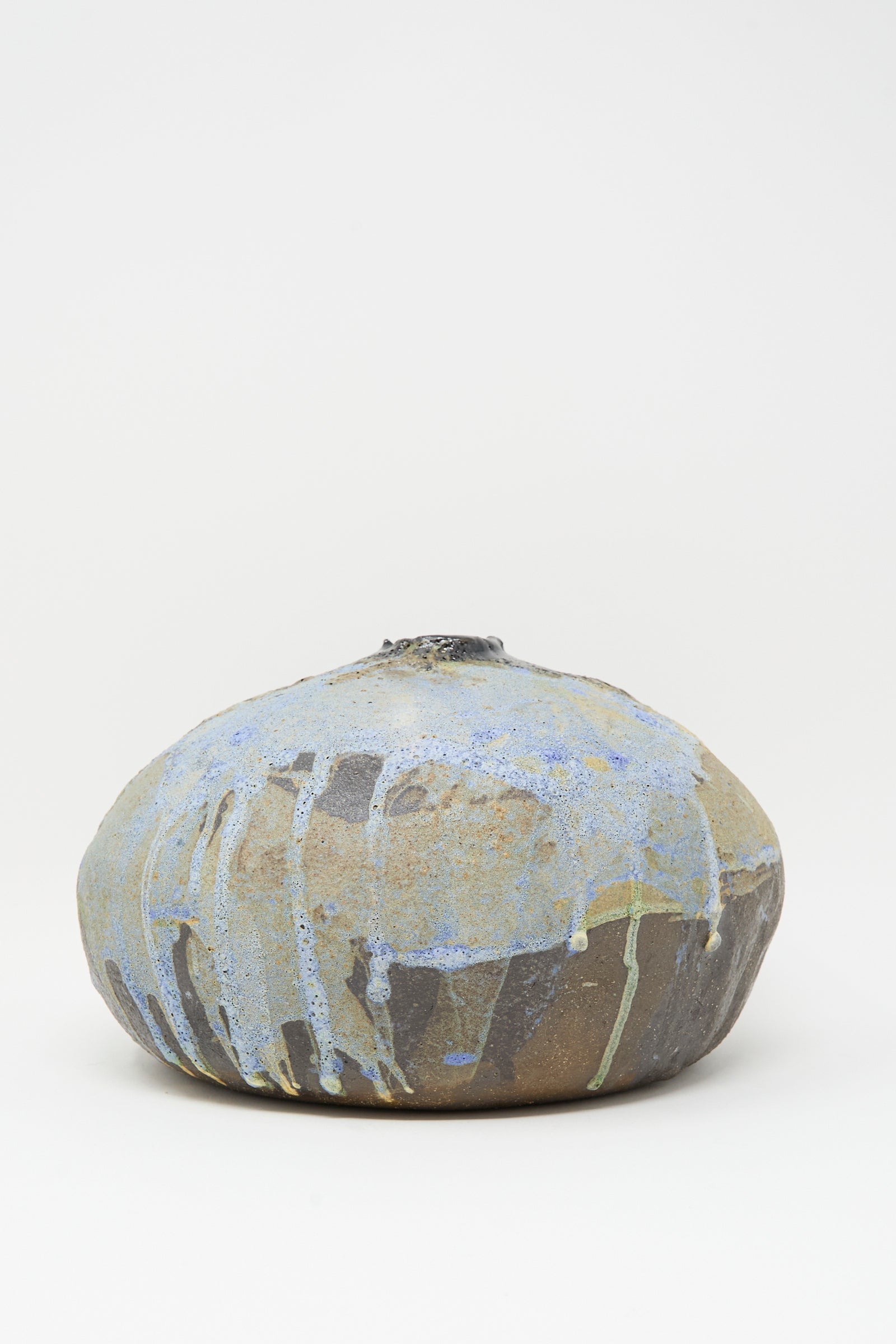 The MONDAYS Textured Moon Vase in Black is a rounded handmade vase with a small top opening and textured surface, shown against a plain white background.