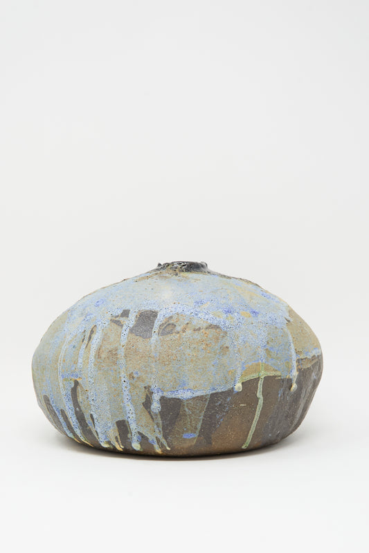 The MONDAYS Textured Moon Vase in Black is a rounded handmade vase with a small top opening and textured surface, shown against a plain white background.