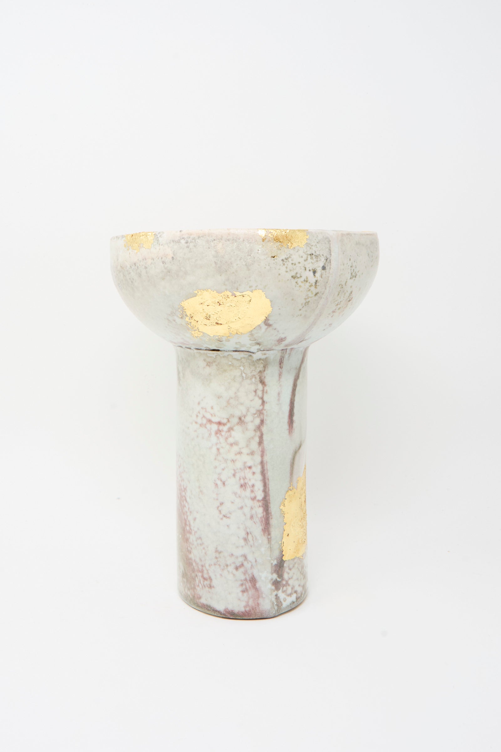 The MONDAYS Wood-Fired Porcelain Pedestal Bowl features gold leaf accents and marbled patterns on a white base.