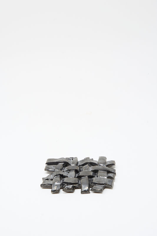 The MONDAYS Woven Dish in Charcoal, a small rectangular ceramic piece with a charcoal glaze, is centered on a plain white background.