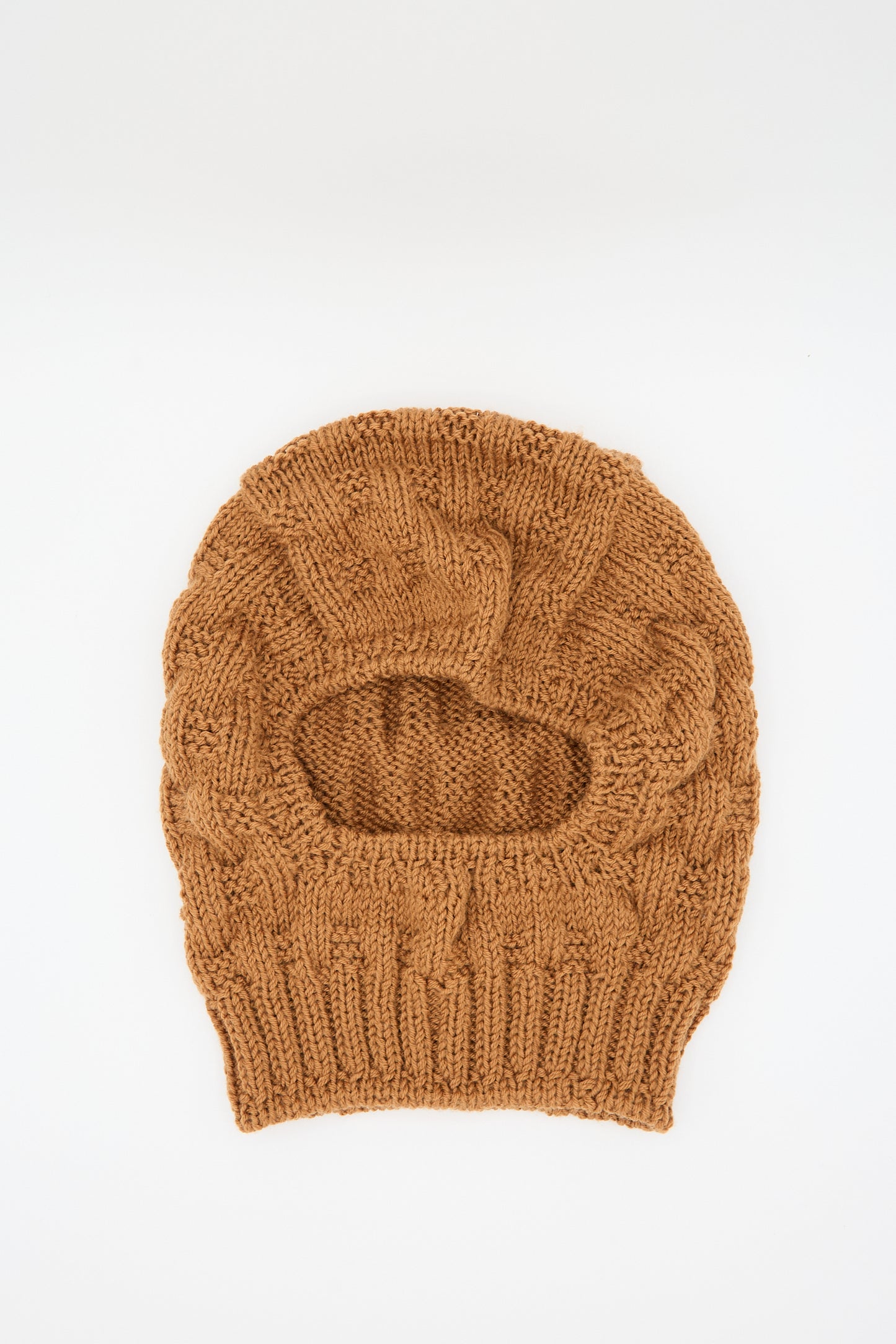 The Maria La Rosa "Balaclava in Rust” with a checkered weave and an opening for the eyes and nose is laid flat against a plain white background.