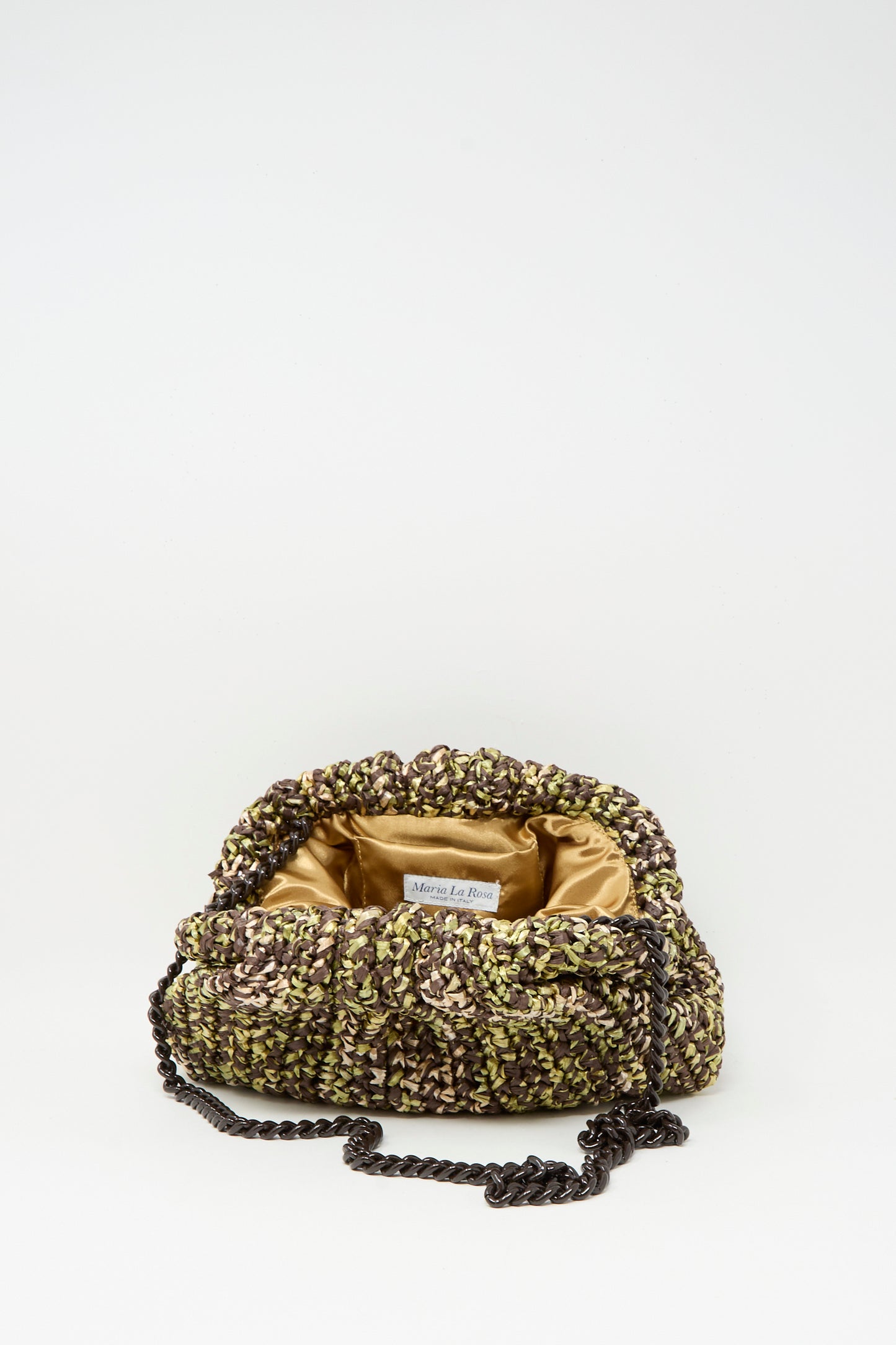 The Earth Game Crochet Bag in Natural by Maria La Rosa, with a chain strap and visible brand label, is elegantly displayed open to reveal its golden satin interior against a plain white background.