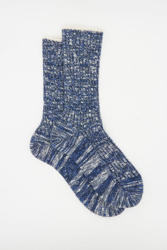 The Maria La Rosa Earth Sock in Navy, featuring a blue and white melange pattern, is made in Italy and shown laid flat on a white background.