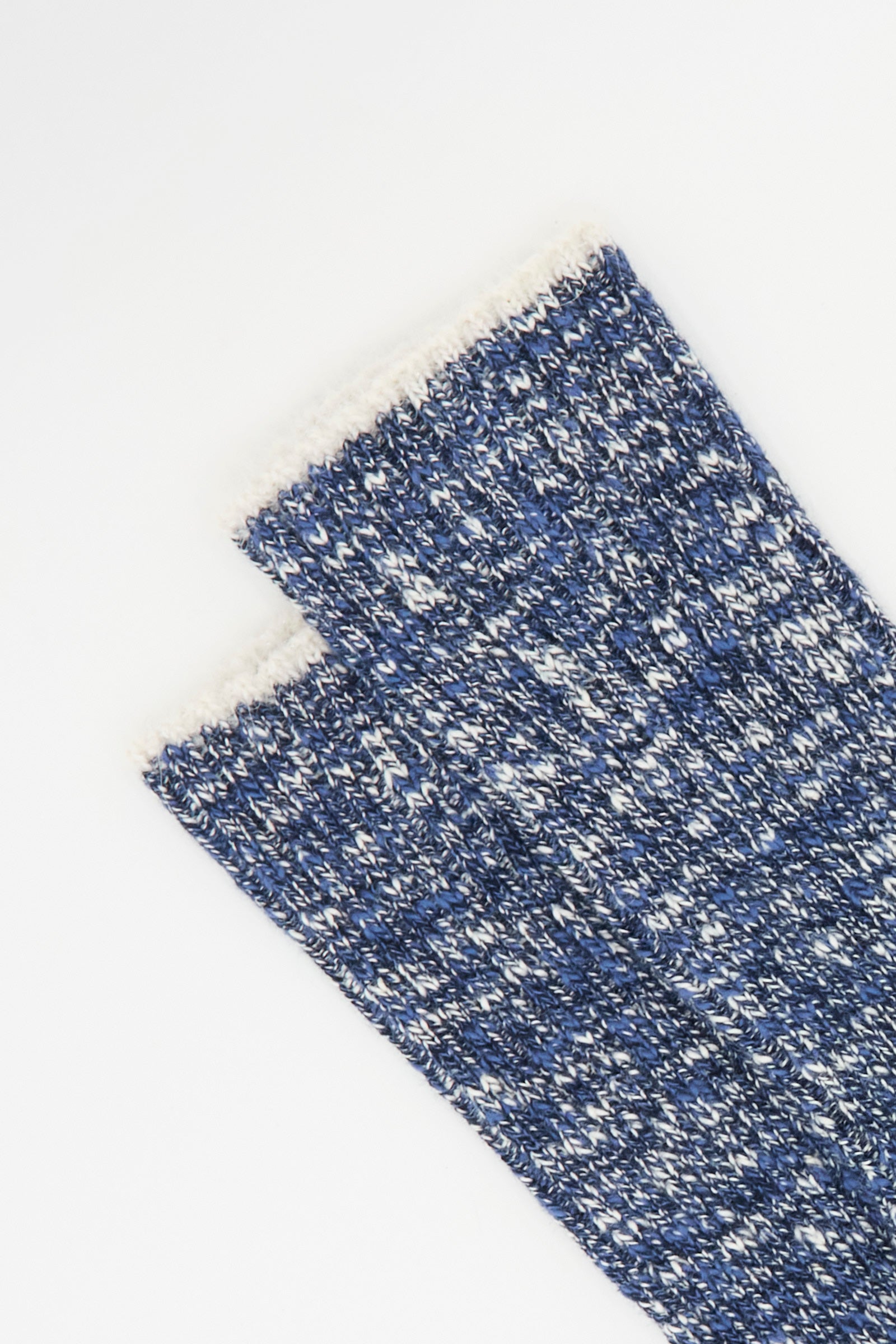A close-up of two Maria La Rosa Earth Socks in Navy, featuring chunky blue and white cotton knit with a fuzzy white trim, displayed on a plain white background.