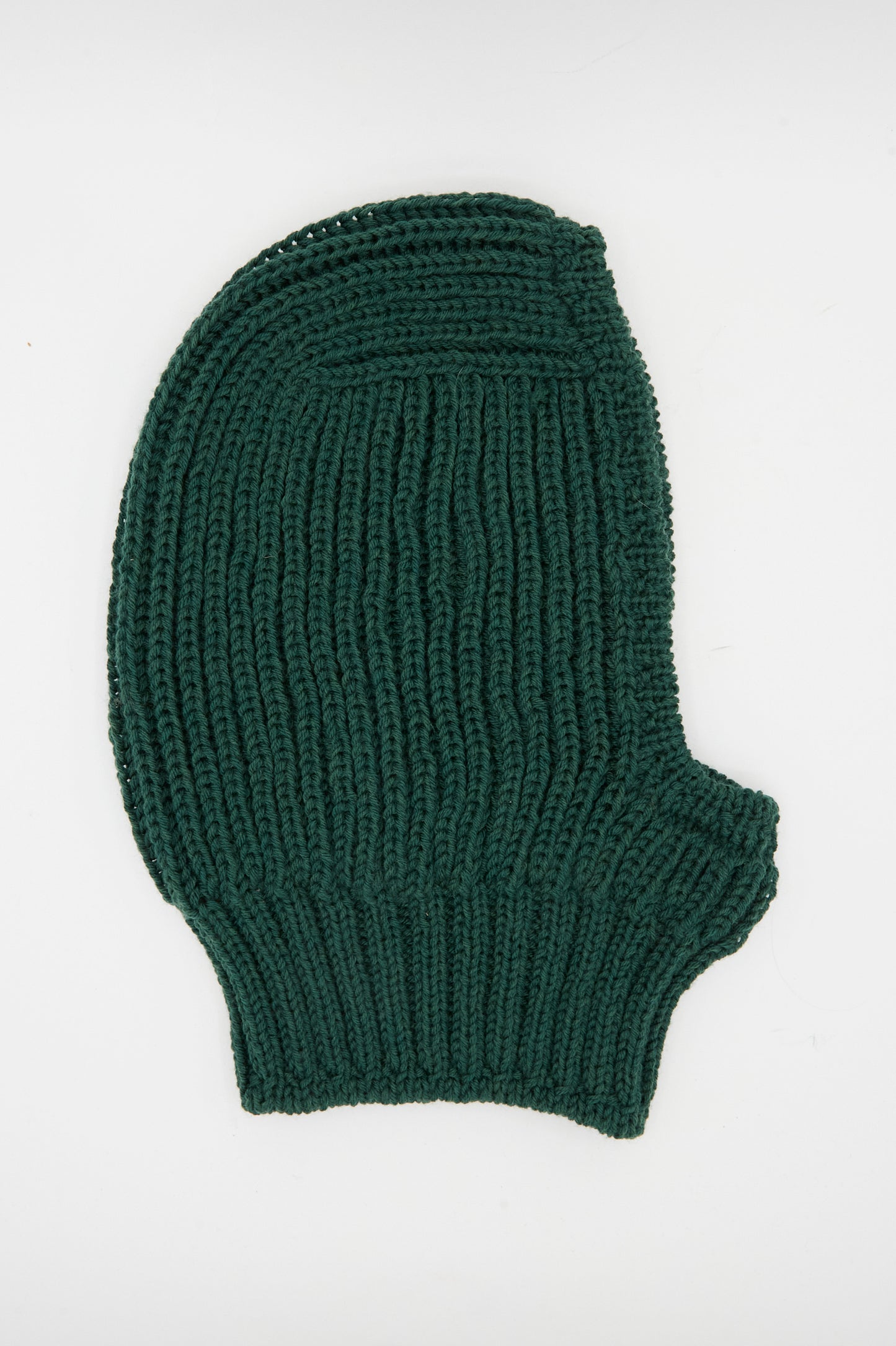 The Maria La Rosa Wool Balaclava Lina in Emerald, a dark green rib knit piece handmade in Italy, is laid flat on a white background.