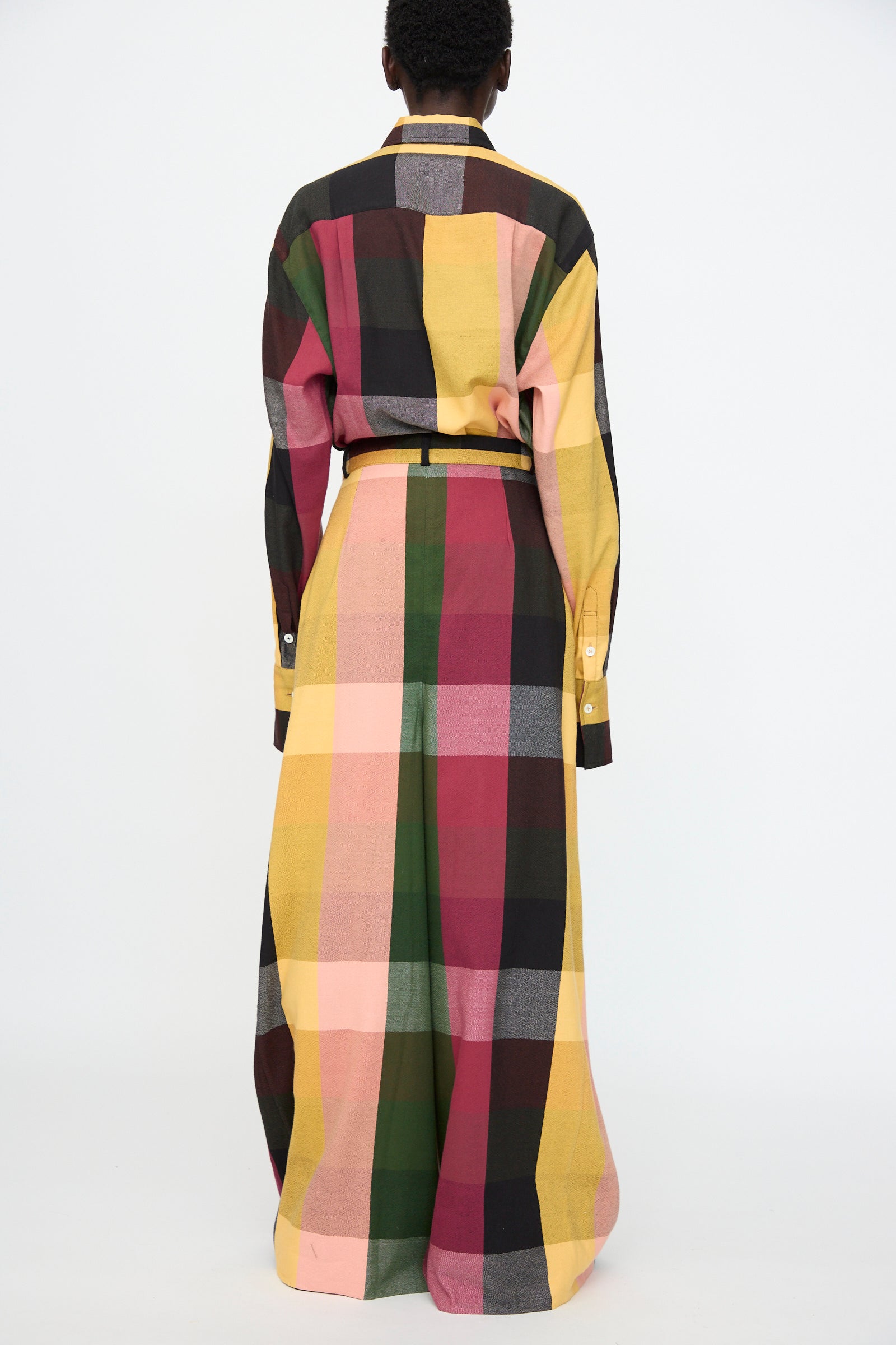 Person wearing the Marrakshi Life High Waisted Pleated Trouser in Plaid Multi, shown from the back against a plain white background.