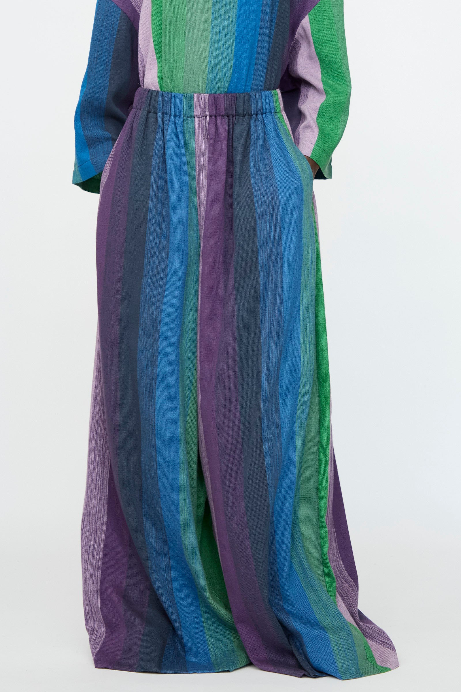 The Marrakshi Life Wide Leg Pant in Stripe Multi features blue, green, and purple stripes with an elasticated waist for effortless comfort.