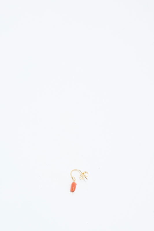 The Mary MacGill 14K Crescent Charm Single Earring in Coral Pebbles is displayed on a plain white background.