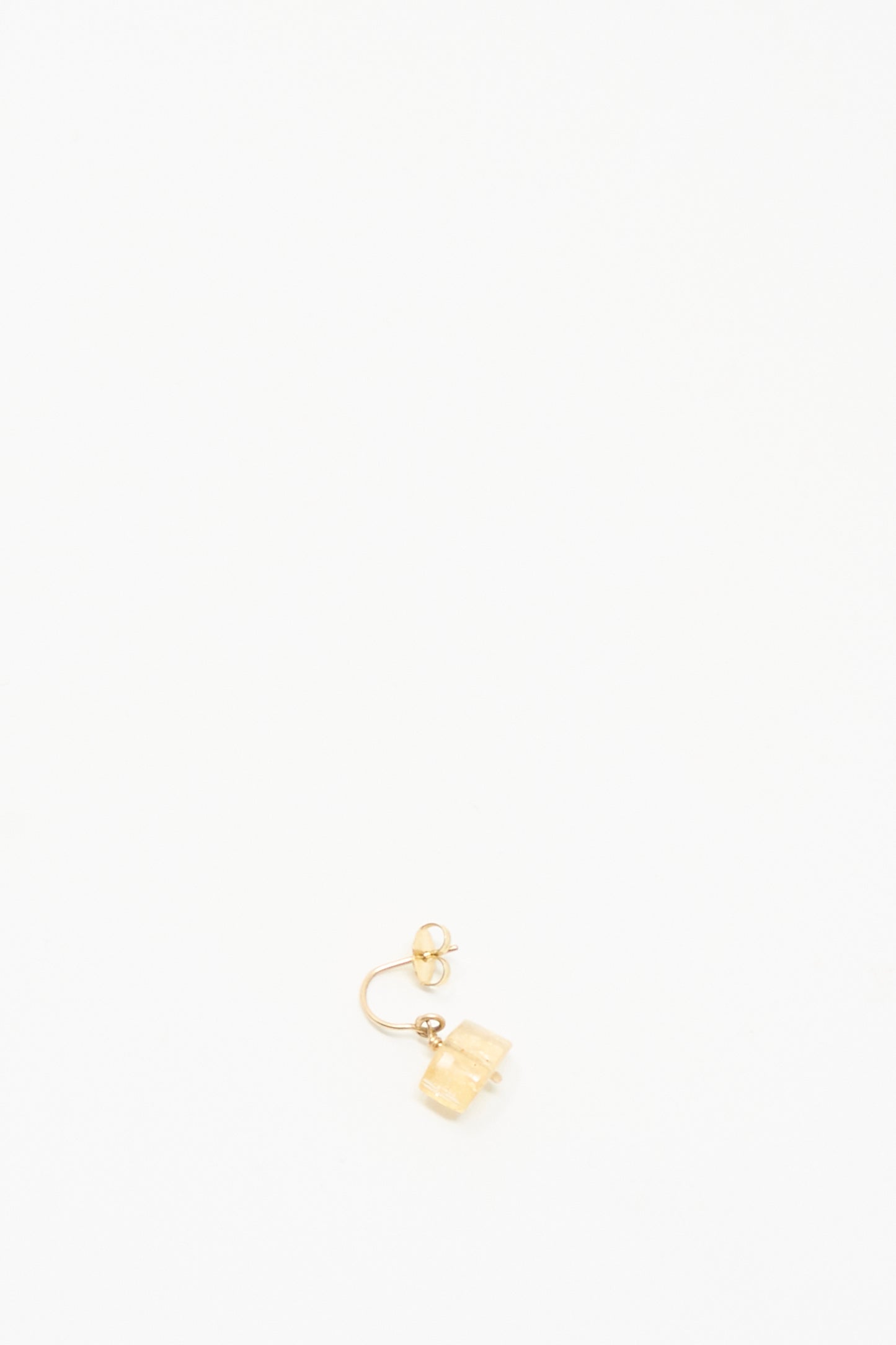 The Mary MacGill 14K Crescent Charm Earring in Imperial Topaz features a single light-hued rectangular charm and is shown on a simple white background.