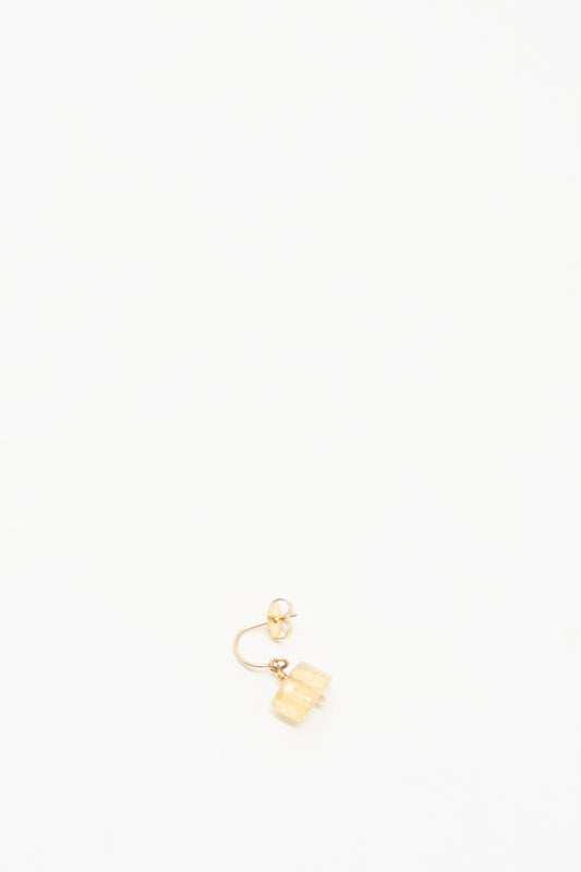 The Mary MacGill 14K Crescent Charm Earring in Imperial Topaz features a single light-hued rectangular charm and is shown on a simple white background.