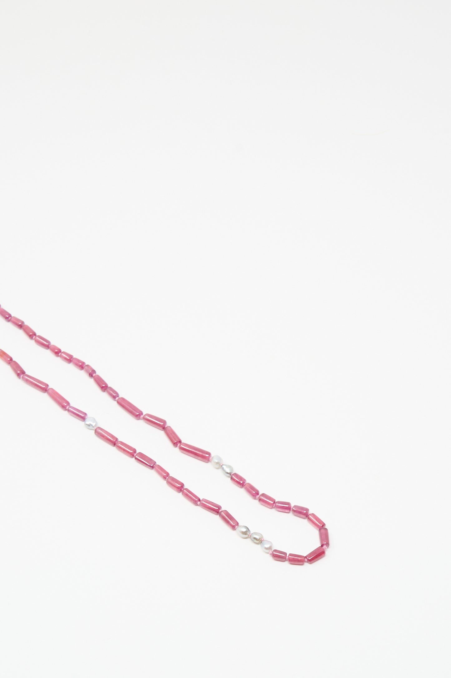 The 14K Stone Layering Necklace by Mary MacGill features ruby and Keshi pearl stones, displayed on a white background.