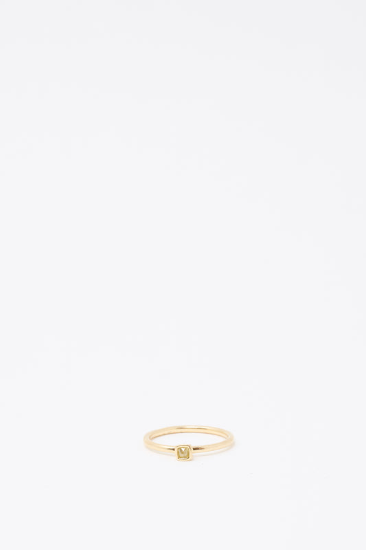 The Mary MacGill 14K Floating Ring features a petite, light green rose cut mineral diamond in a square setting, shown against a white background.
