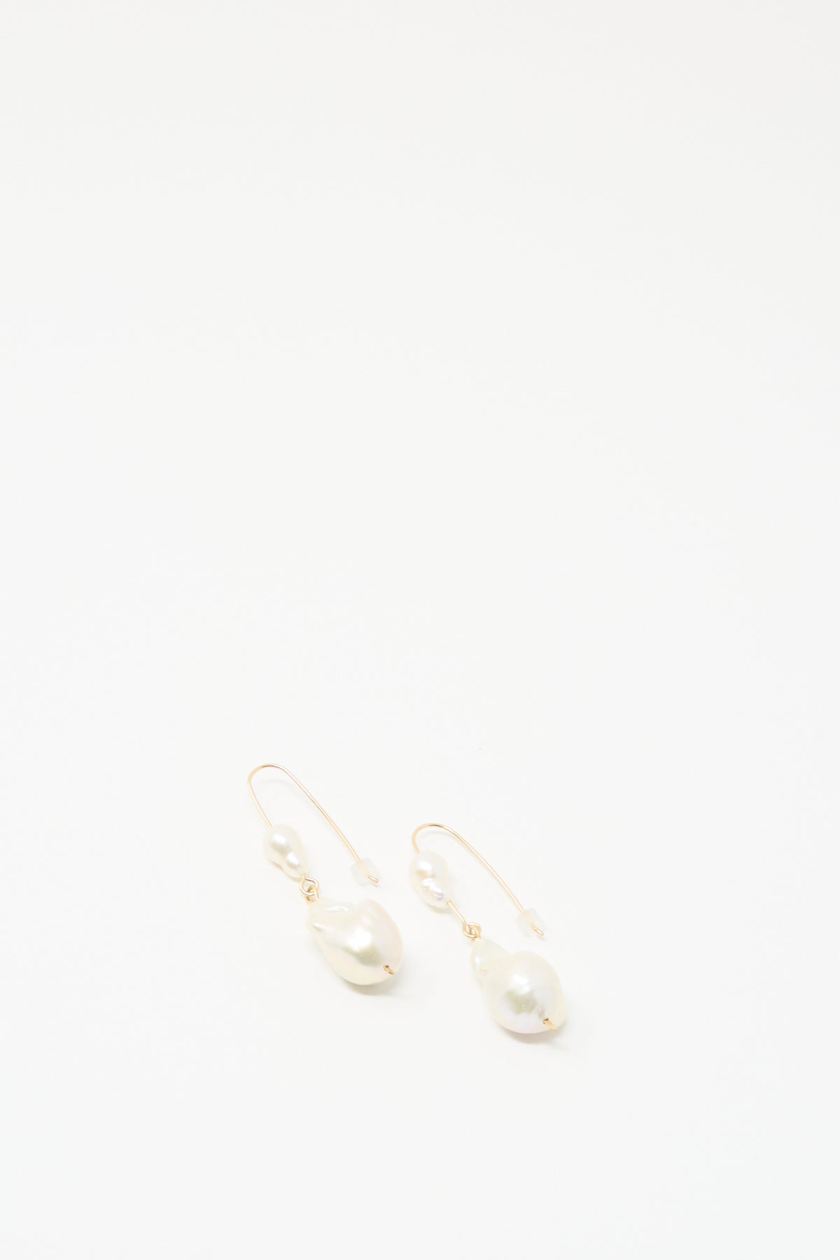 Baroque Pearl Double Drop Earrings in White by Mary MacGill feature handmade irregular and round pearls, shown on a plain white background.