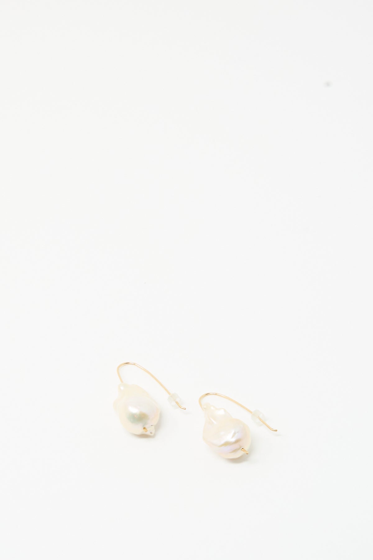 Baroque Pearl Drop Earrings in White by Mary MacGill showcase gold-filled wire and unique pearls, elegantly displayed on a plain white background.