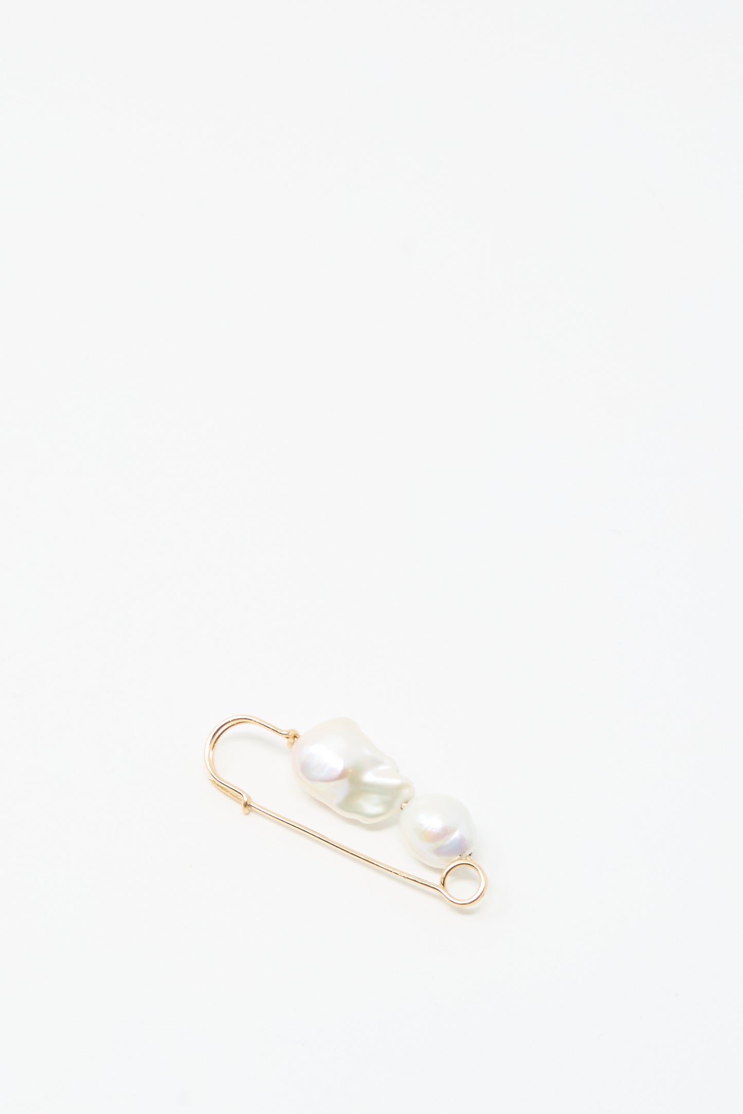 The Mary MacGill Baroque Pearl Pin in White features two handmade Baroque pearls on a gold-filled safety pin, shown against a plain white background.