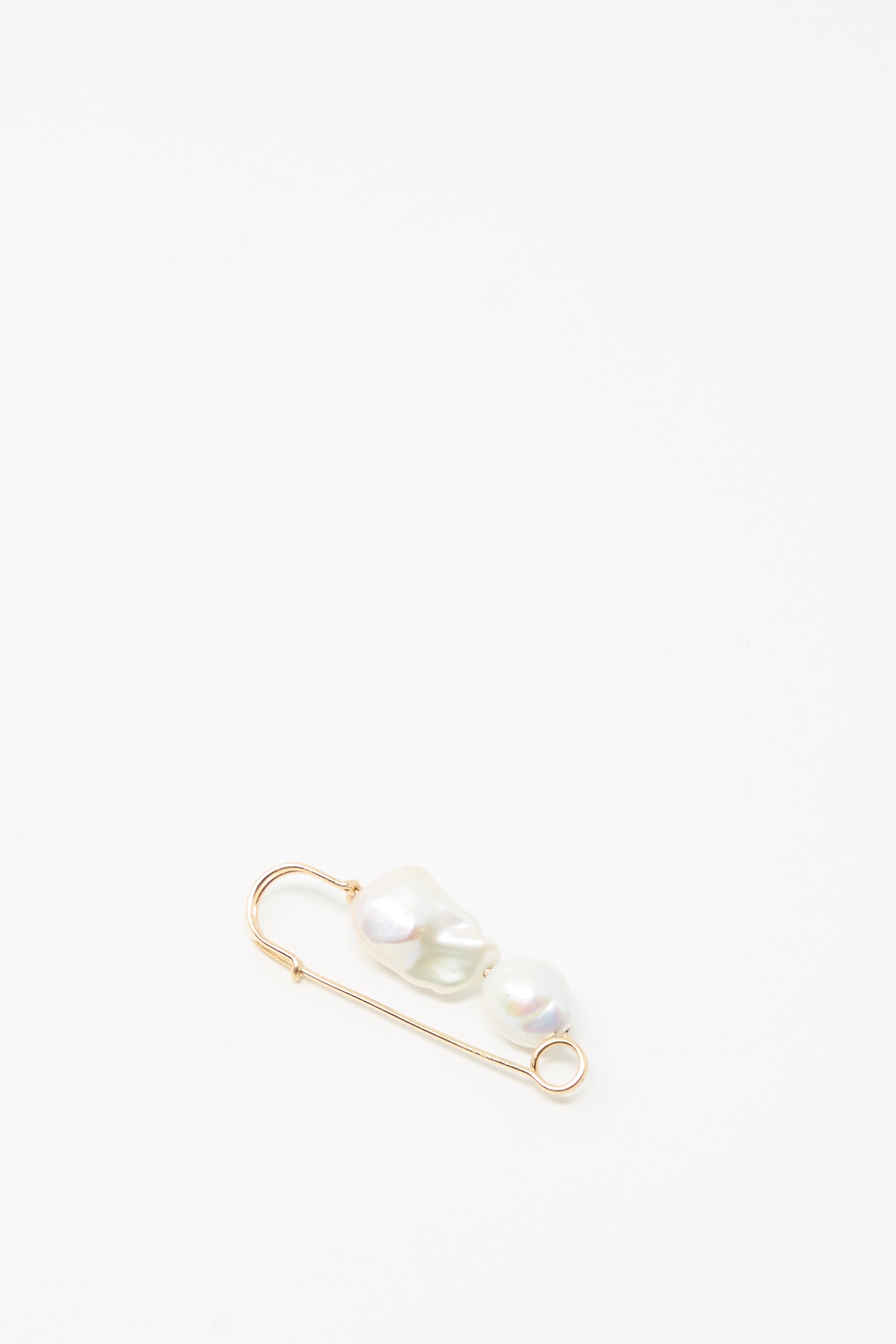The Mary MacGill Baroque Pearl Pin in White features two handmade Baroque pearls on a gold-filled safety pin, shown against a plain white background.