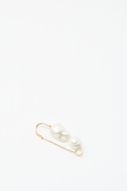 The Mary MacGill Baroque Pearl Pin in White features two handmade Baroque pearls on a gold-filled safety pin, shown against a plain white background.