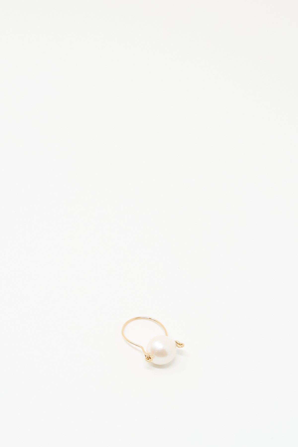 The Mary MacGill Baroque Pearl Ring in White, crafted from gold-filled wire, is shown on a plain white background—an elegant handmade jewelry piece.