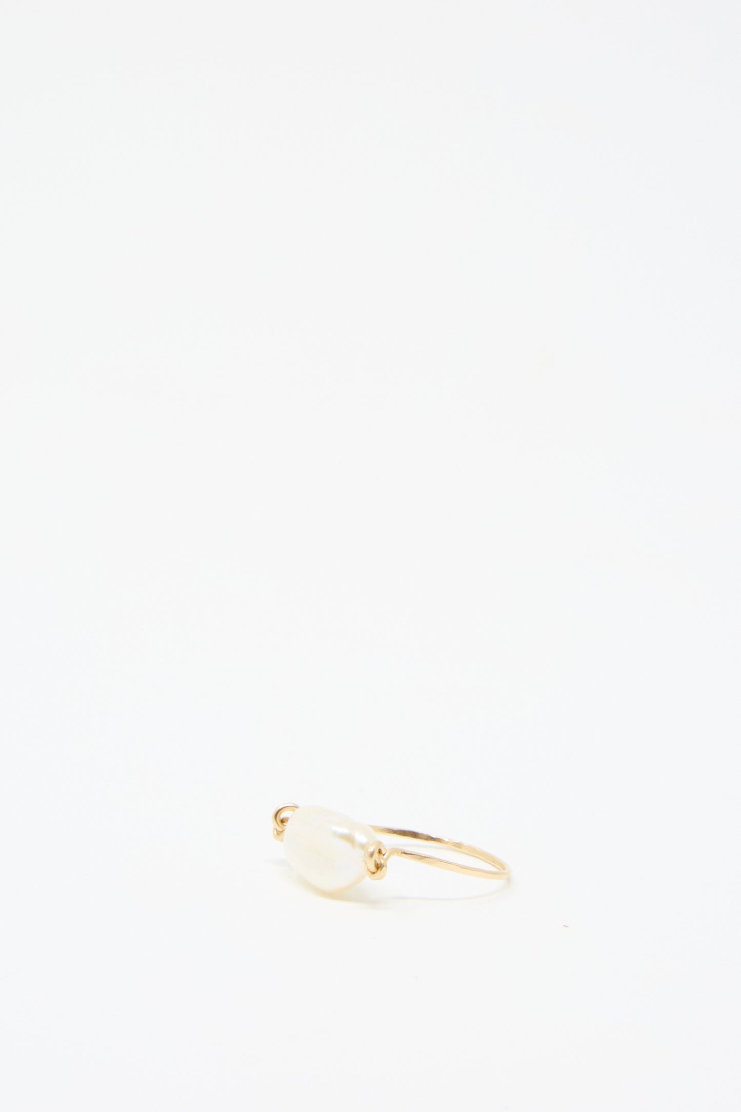 The Baroque Pearl Ring in White by Mary MacGill is elegantly displayed against a plain white background.