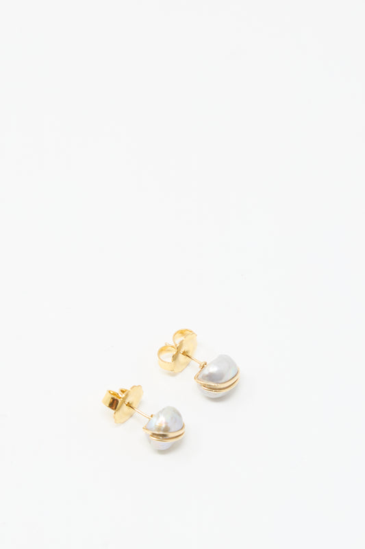 The Grande Baroque Pearl Studs in Silver by Mary MacGill feature silver baroque pearls wrapped in gold-filled wire, shown against a plain white background.