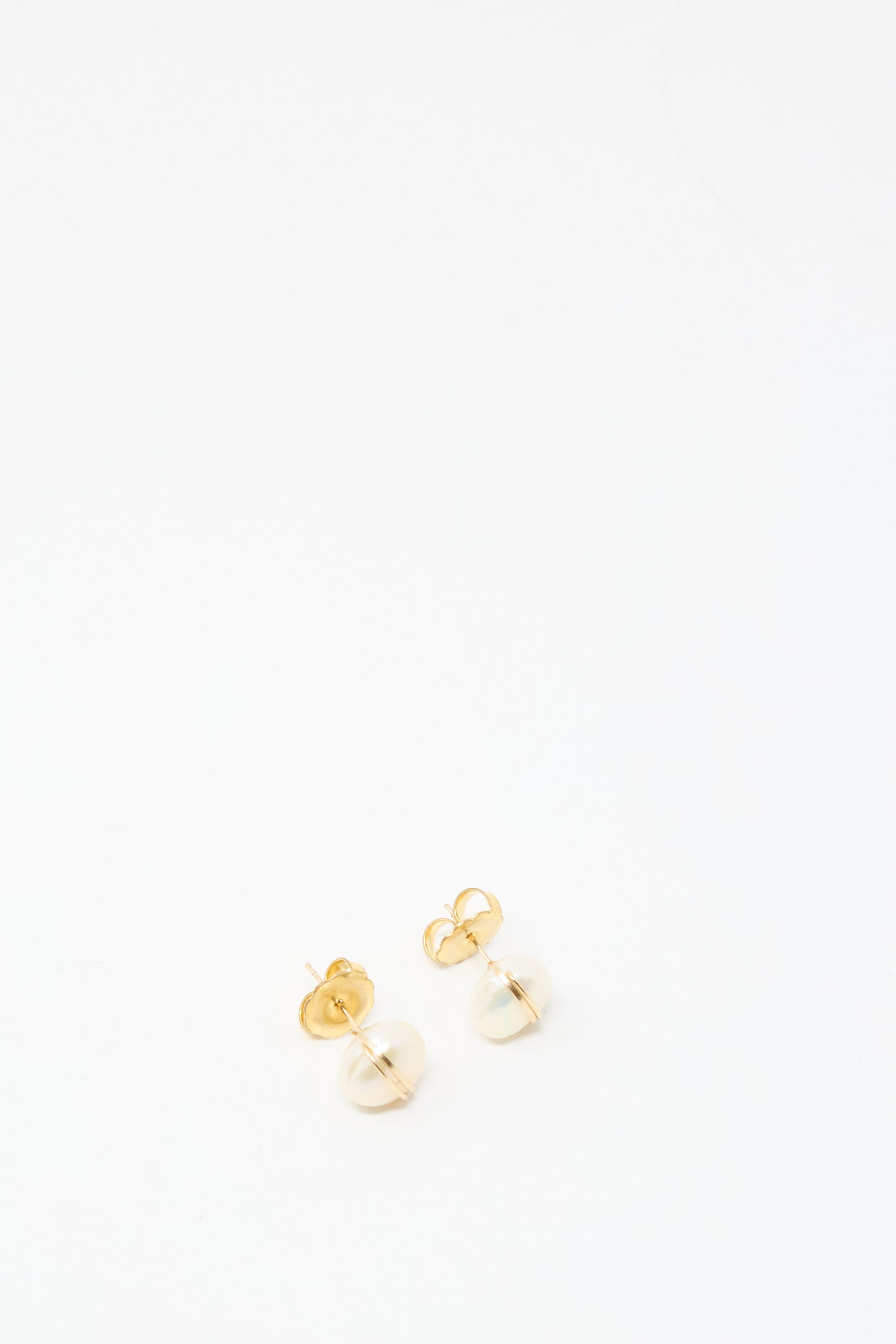 The Mary MacGill Grande Baroque Pearl Studs in White are handmade gold-filled stud earrings with small round pearls, shown on a plain white background.