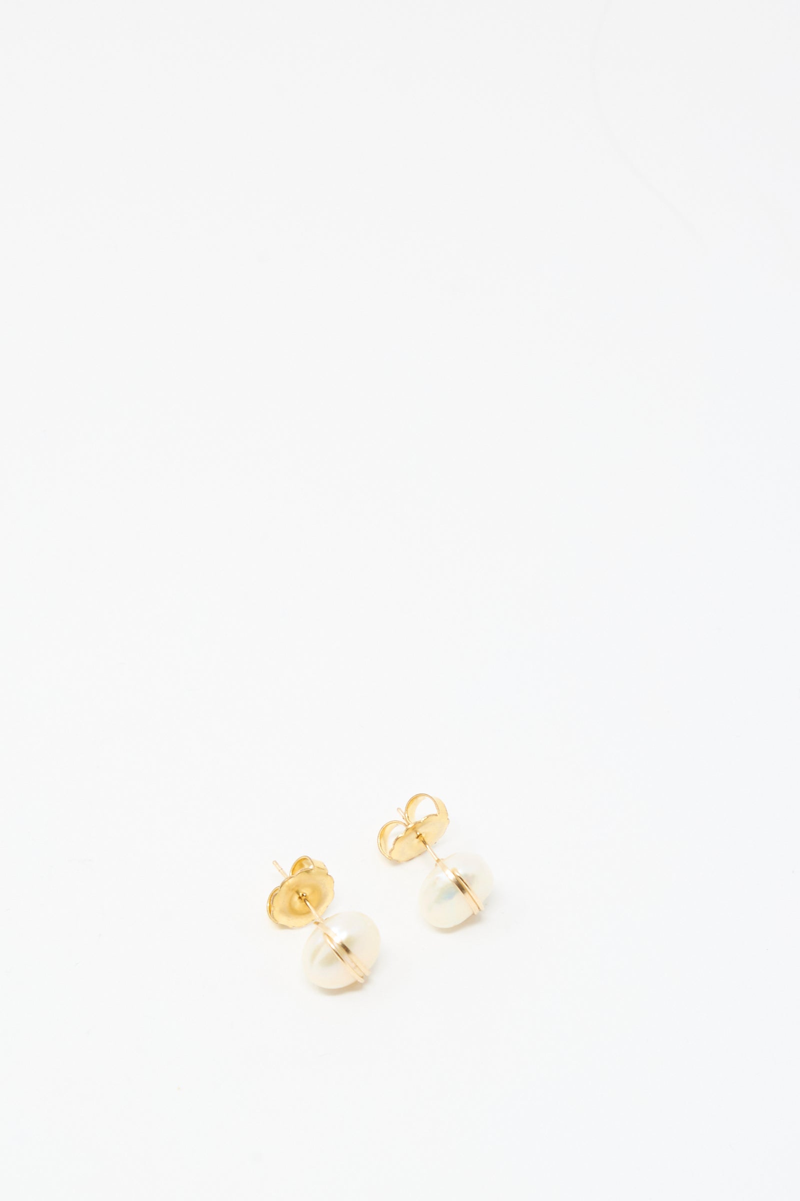 The Mary MacGill Grande Baroque Pearl Studs in White are handmade gold-filled stud earrings with small round pearls, shown on a plain white background.