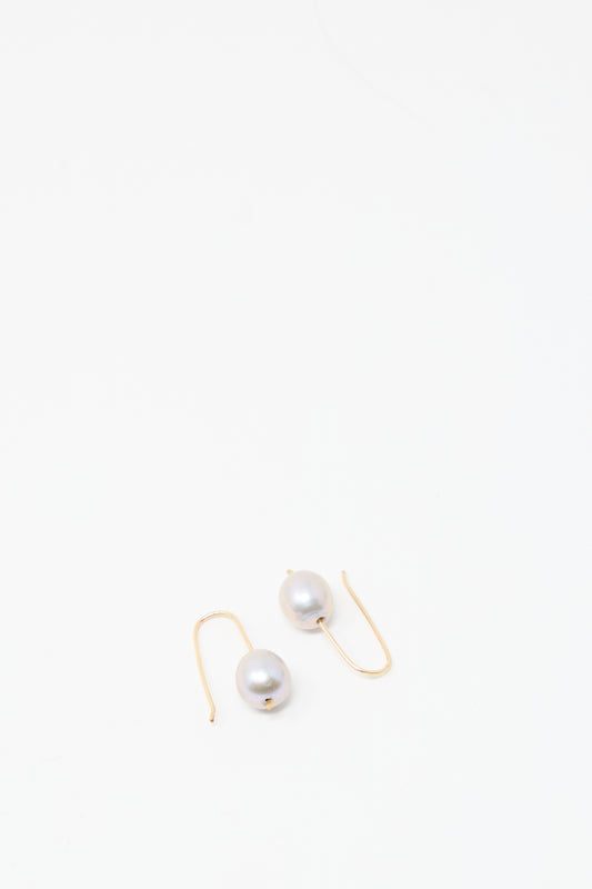 Petite Baroque Pearl Drop Earrings in Silver by Mary MacGill with silver earring wire, shown on a plain white background.