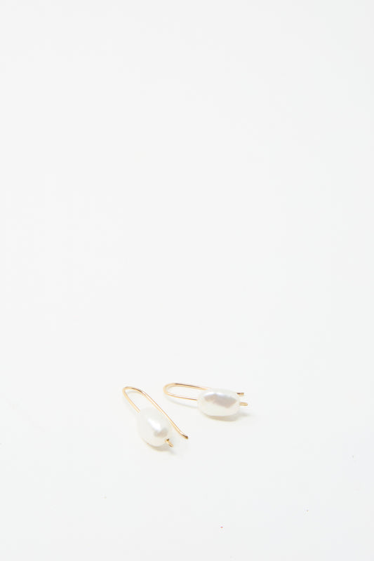 Two exquisite Petite Baroque Pearl Drop Earrings in White by Mary MacGill are beautifully showcased on a white background.