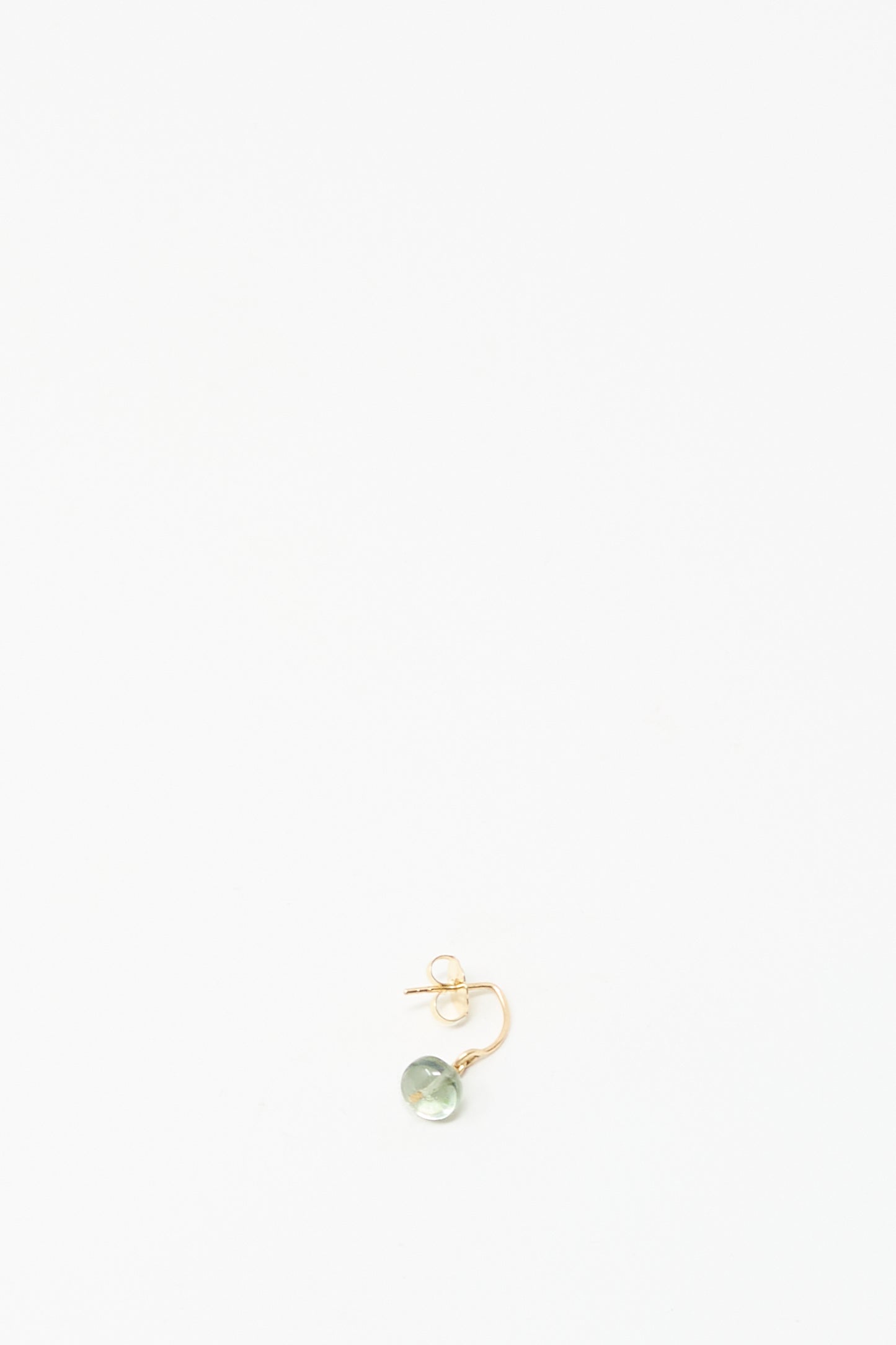 The Mary MacGill 14K Crescent Charm Earring features a round pale tourmaline and rests on a plain white background.